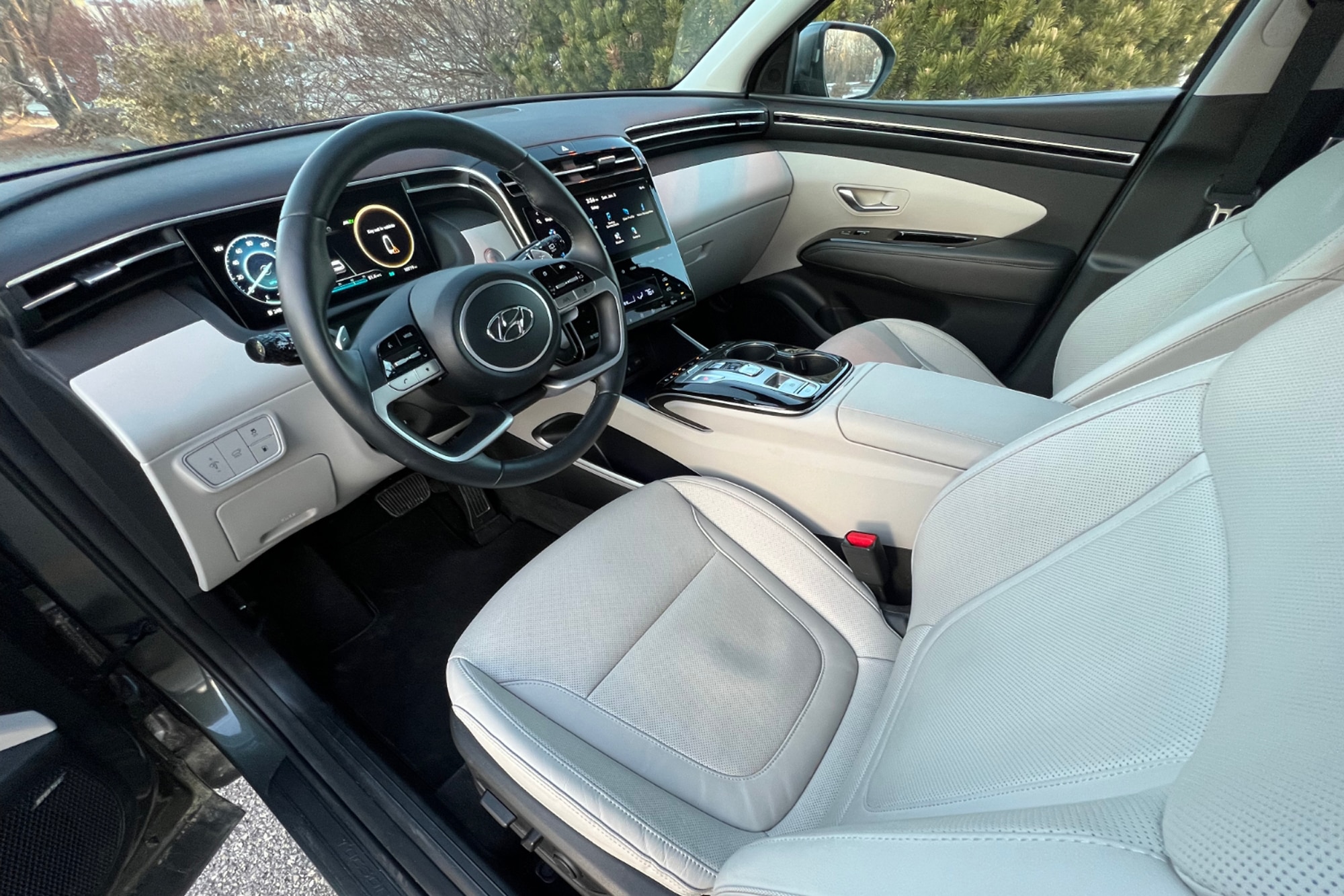 2023 Hyundai Tucson PHEV white interior dashboard and front seats