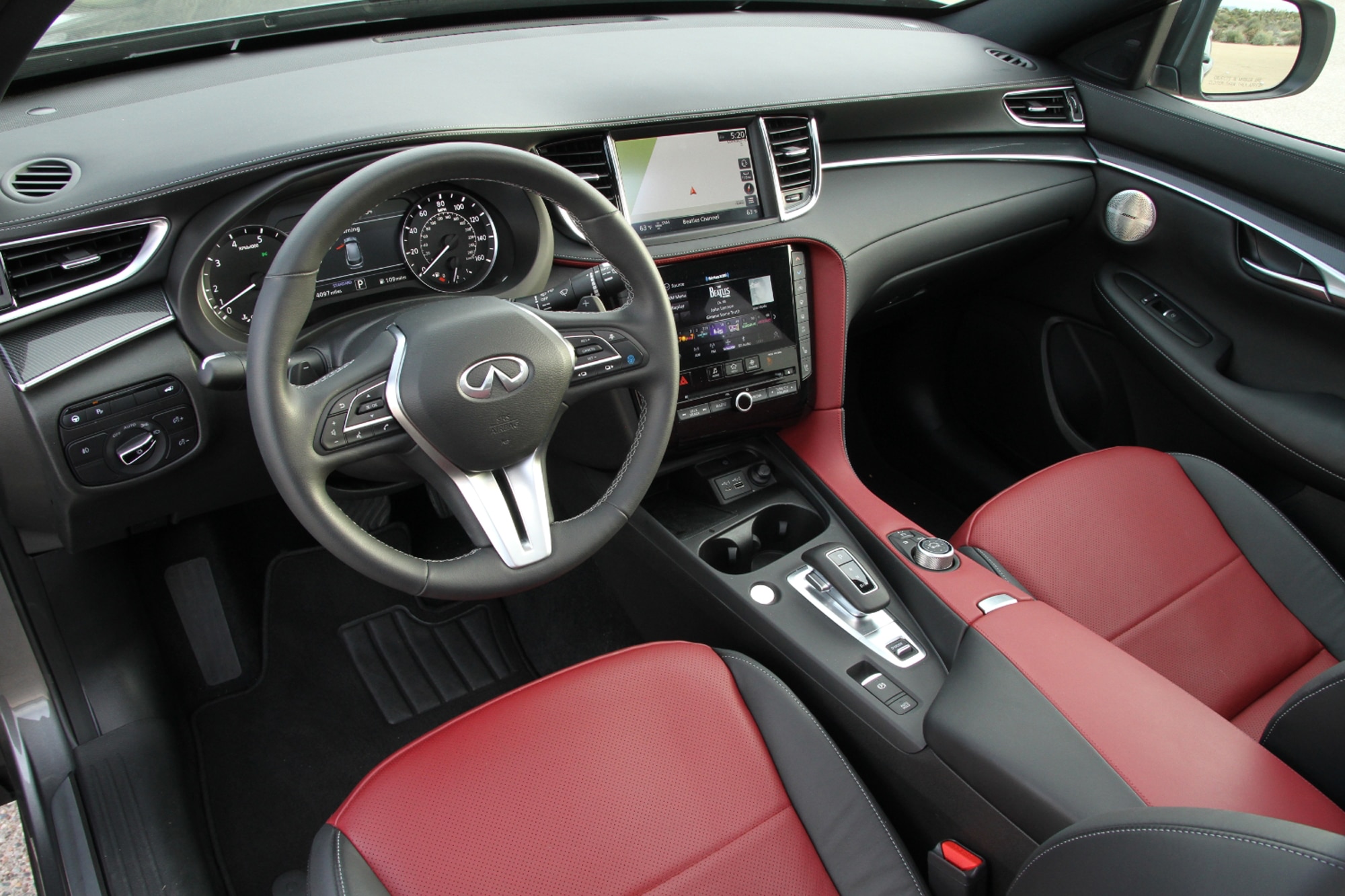2023 Infiniti QX50 Sport red and black interior dashboard