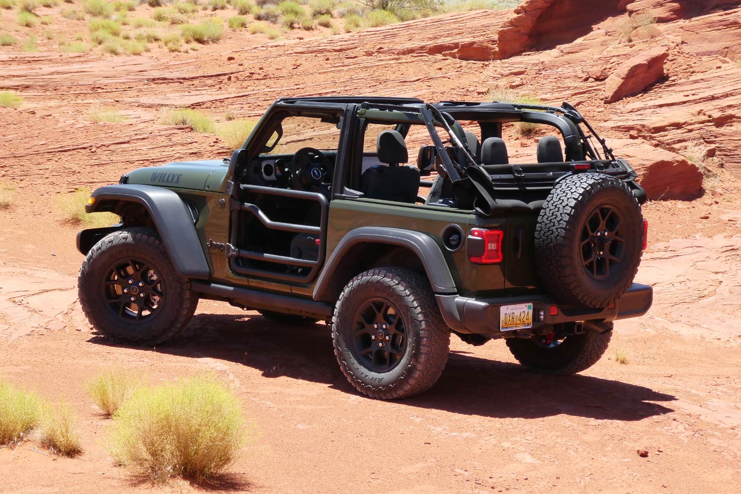 Side view of a green 2024 Jeep Wrangler WIllys