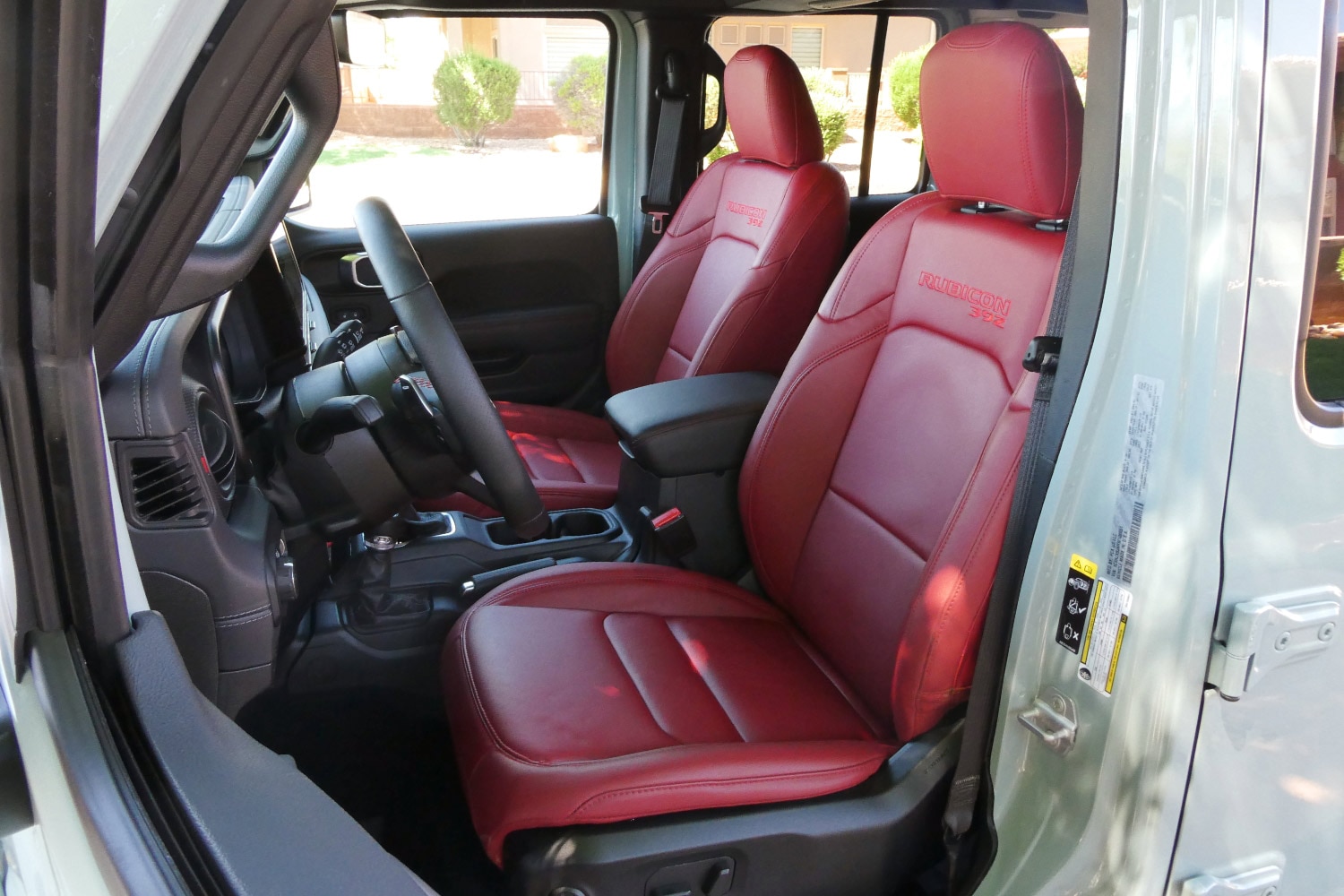 Red front seats of a 2024 Jeep Wrangler Rubicon