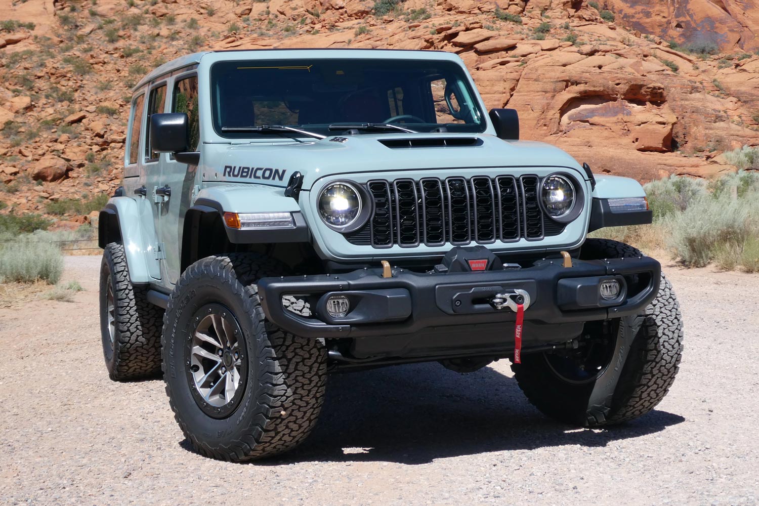 Front view of a light blue 2024 Jeep Wrangler Rubicon