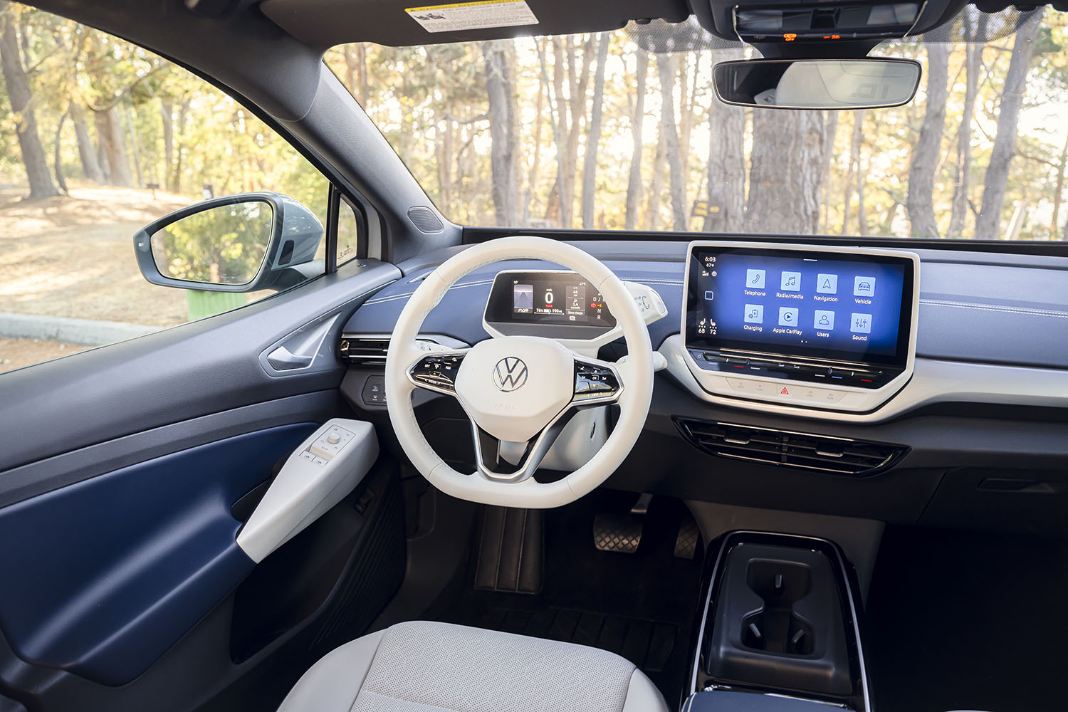 The infotainment screen and driver's seat of a 2023 Volkswagen ID.4 EV