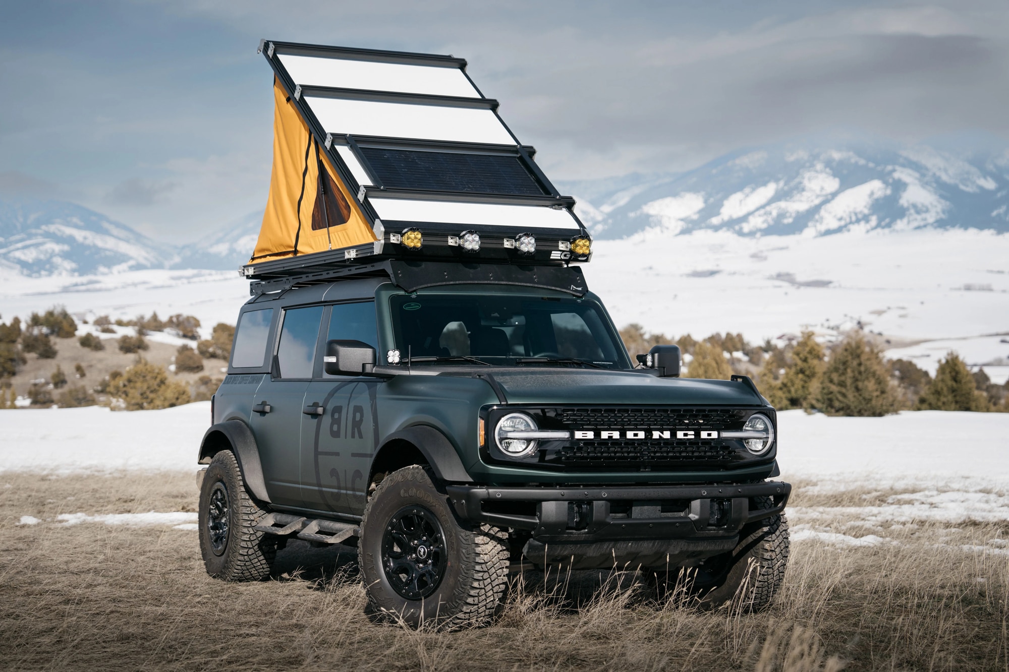 Open Go Fast Campers Platform RTT tent installed on a Ford Bronco in the snow