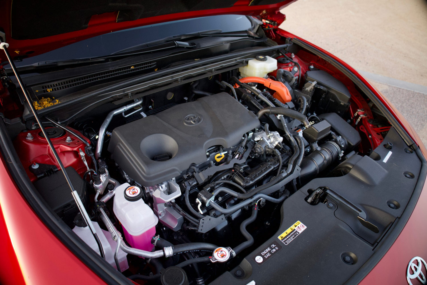 Engine compartment of a red 2023 Toyota Crown