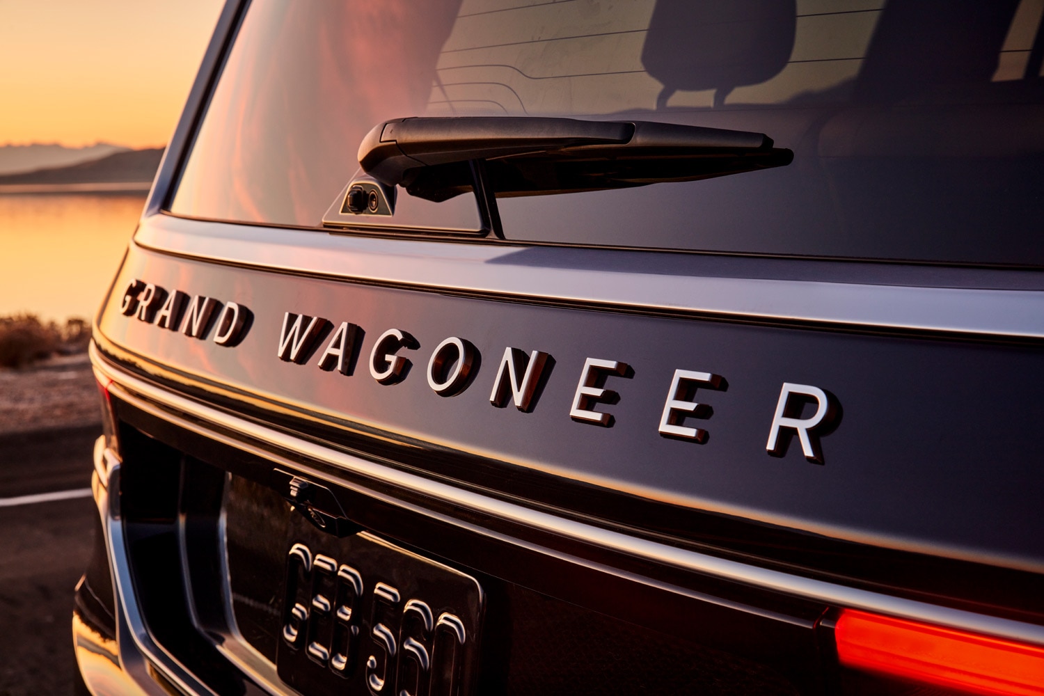 The rear badge on a black 2023 Jeep Grand Wagoneer