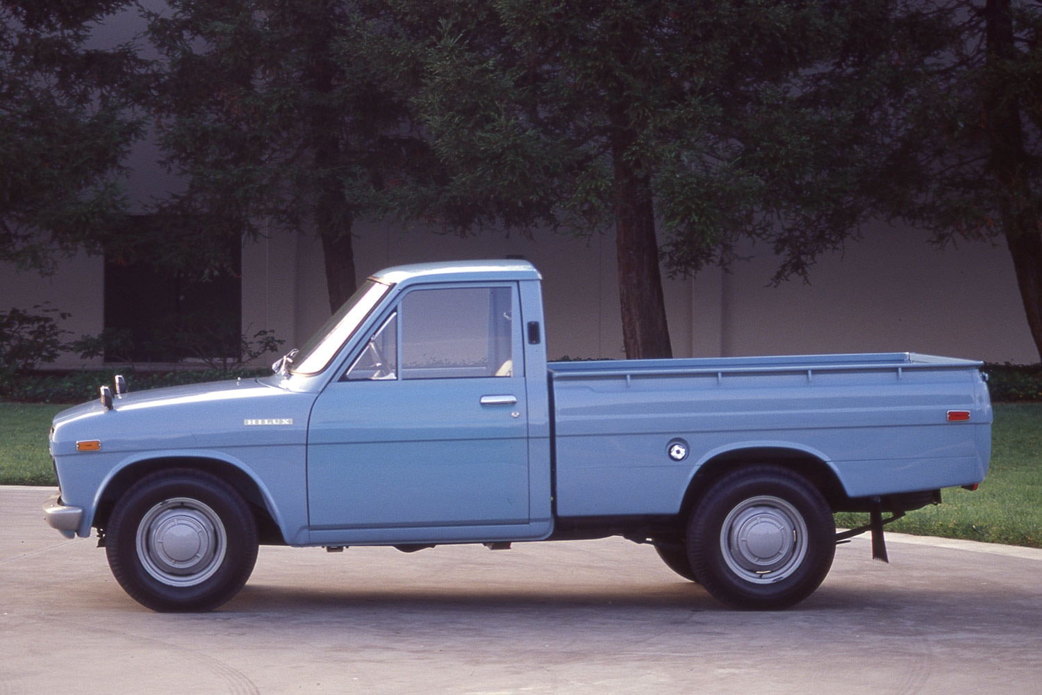 Side view of a light-blue 1971 Toyota Hilux, know in the U.S. as the Toyota Pickup