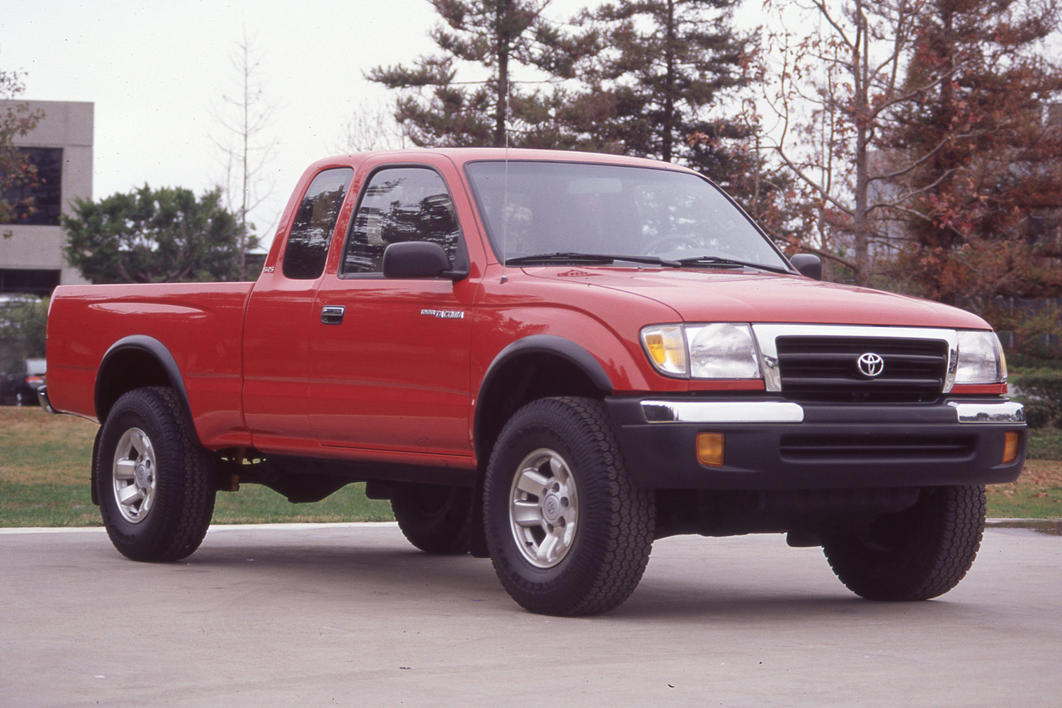 Front three-quarter view of a red 1995 Toyota Tacoma