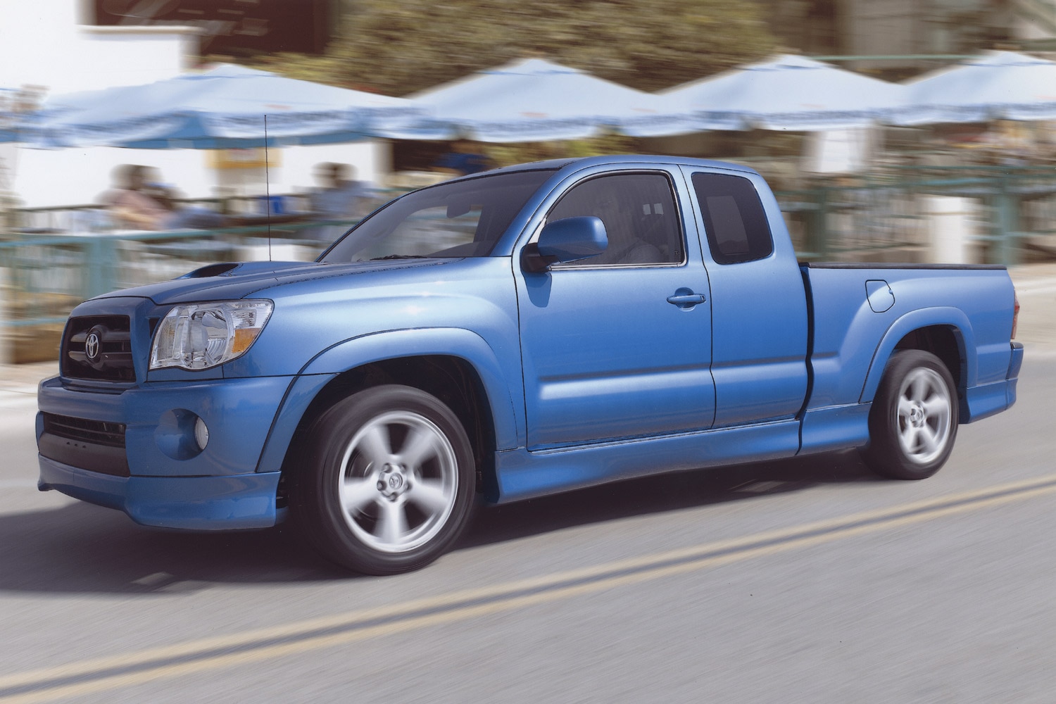  Side view of a blue 2005 Toyota Tacoma X-Runner