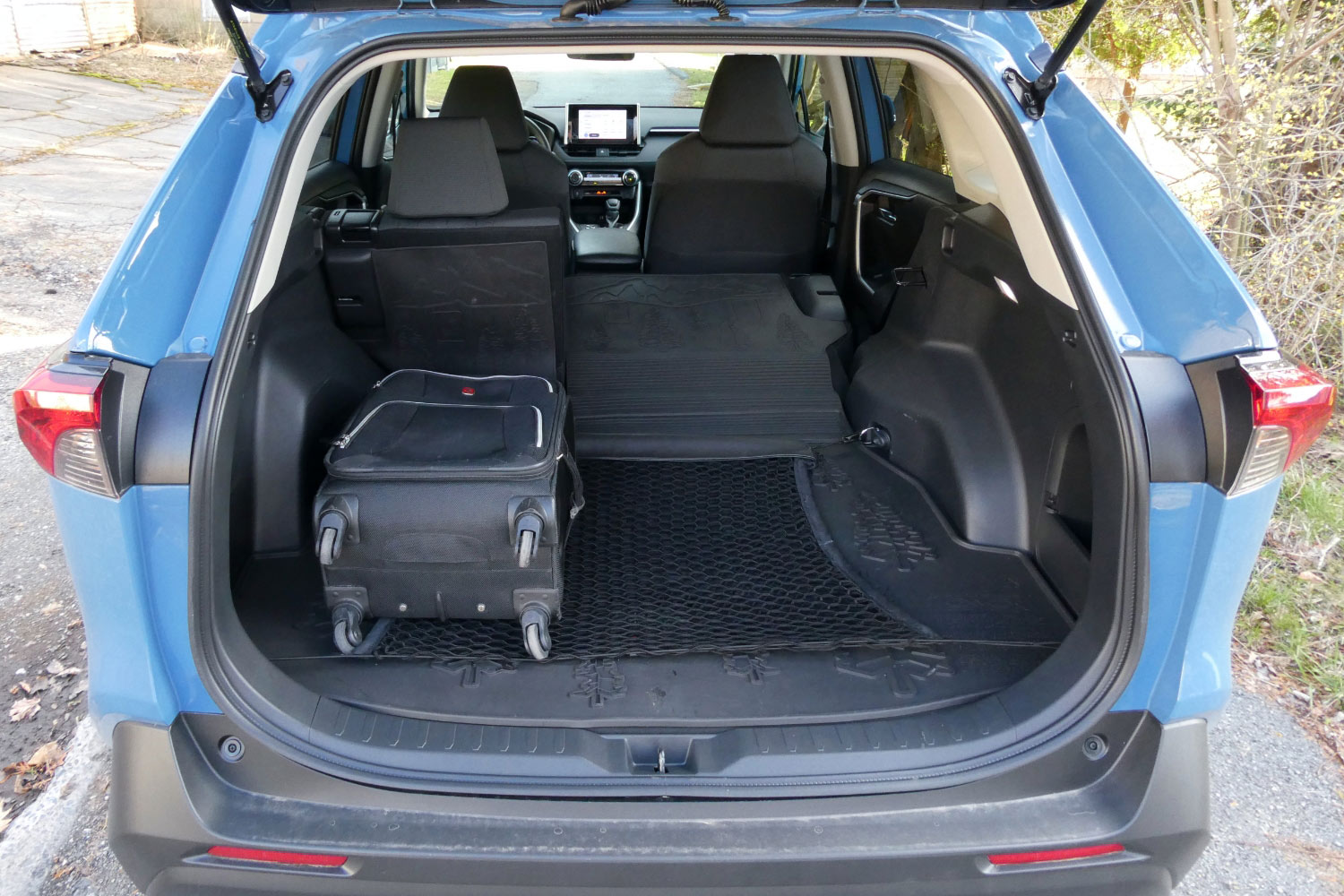 2023 Toyota RAV4 Hybrid Woodland Edition cargo area with luggage