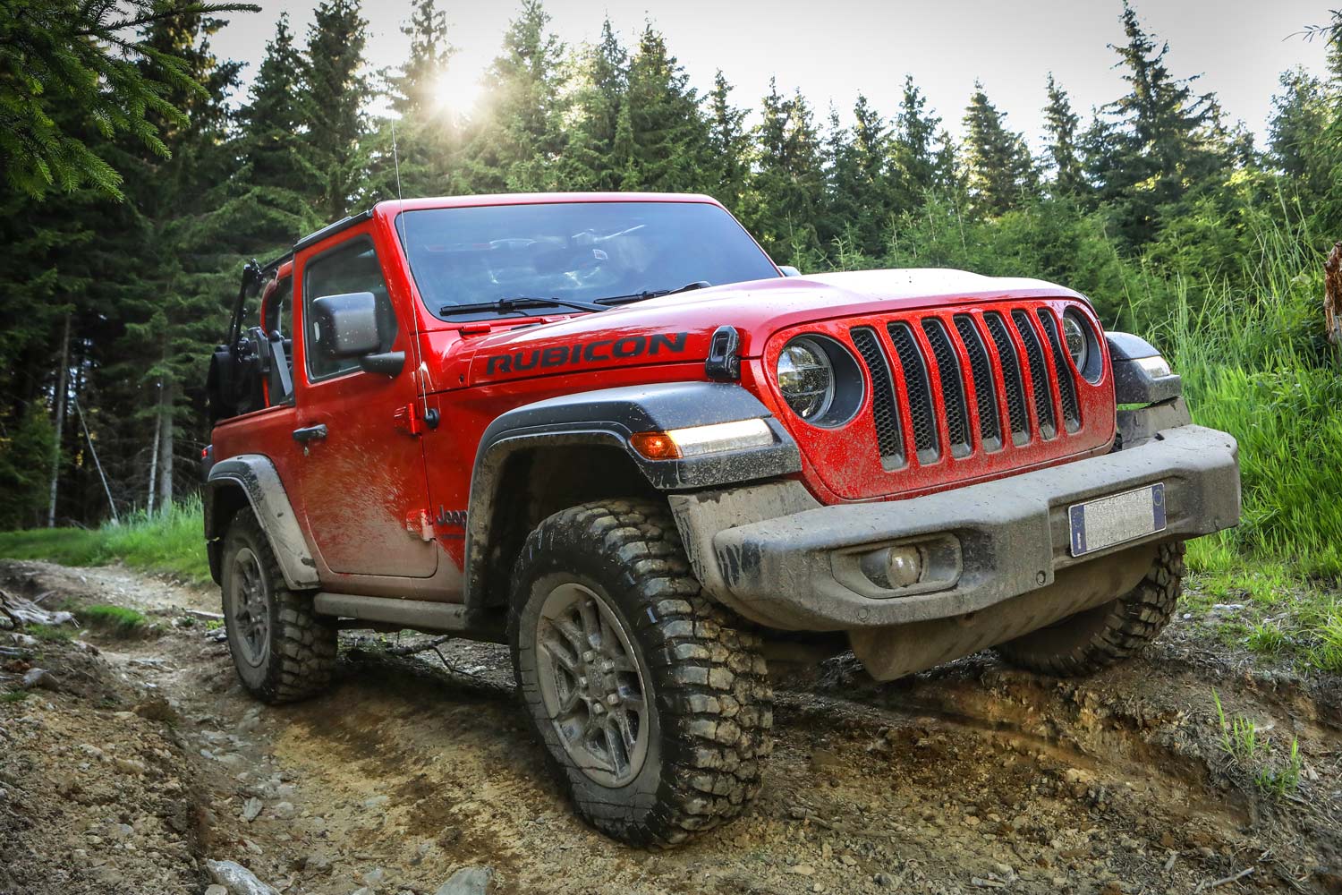 Front three-quarter view of a red Jeep Wrangler Rubicon