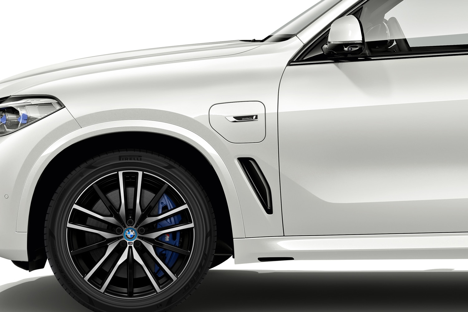 Closeup of Pirelli tire on a white BMW X5