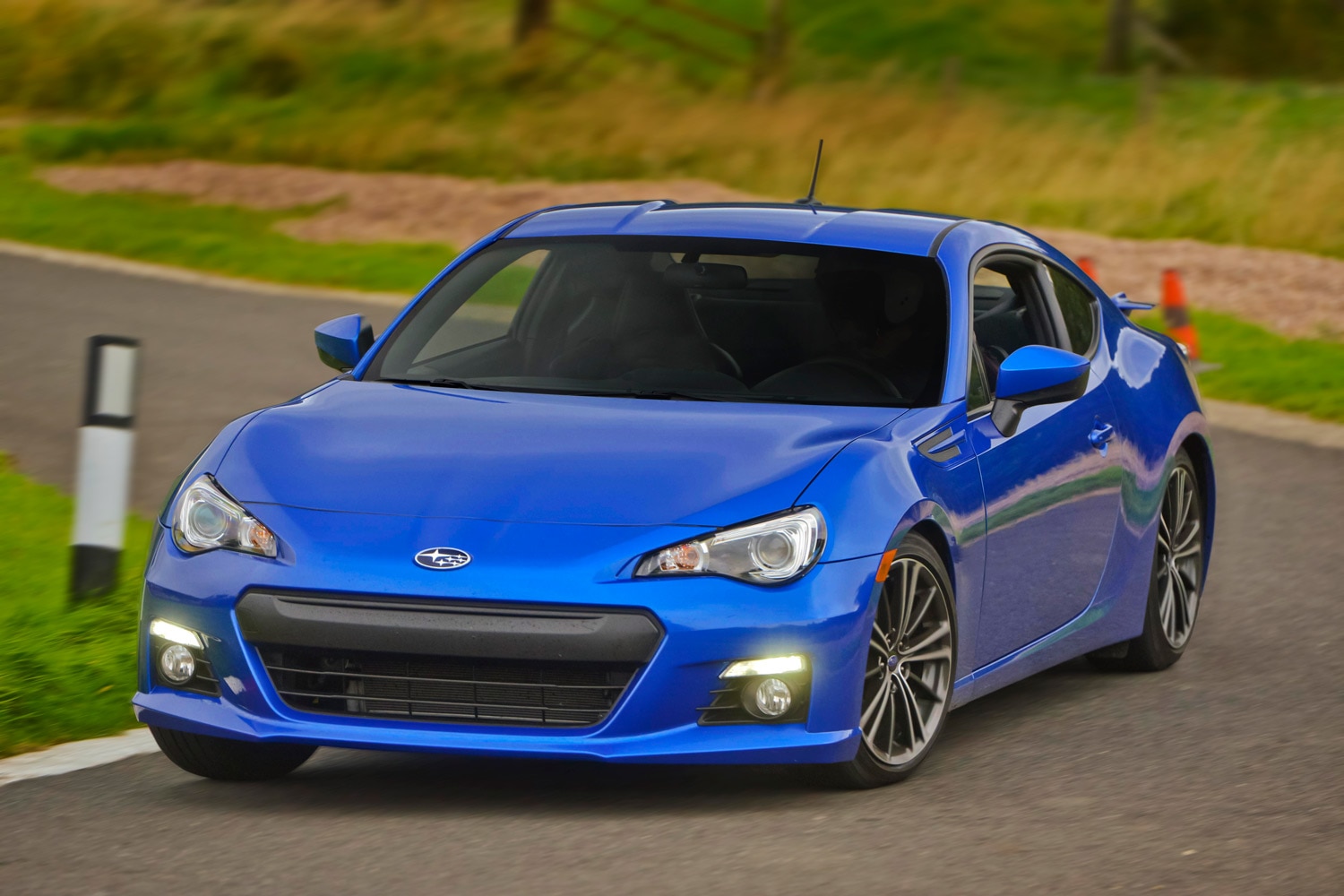 Front three-quarter view of a blue first-generation 2013 Subaru BRZ with Michelin Primacy HP tires