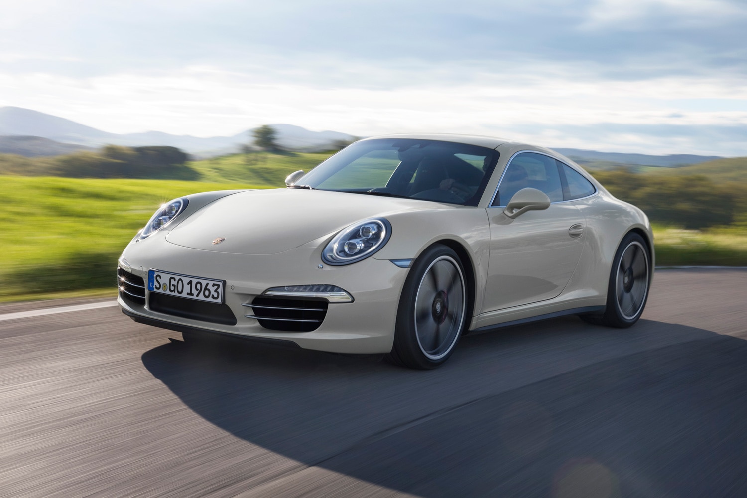 2013 Porsche 911 50th Anniversary Edition driving on a country road