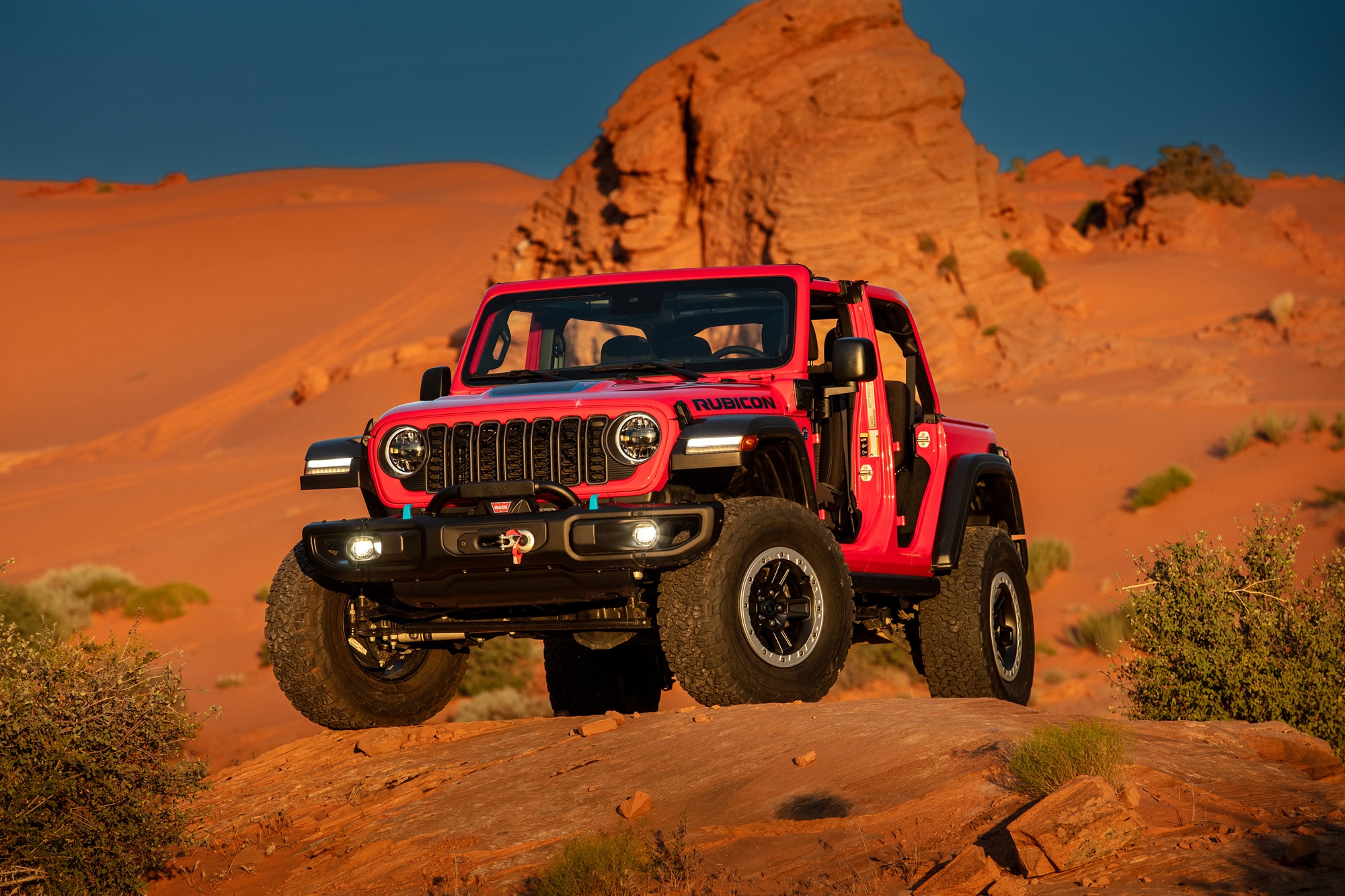 Red 2024 Jeep Wrangler 4xe Rubicon with Jeep Performance Parts 2-inch lift kit in the desert
