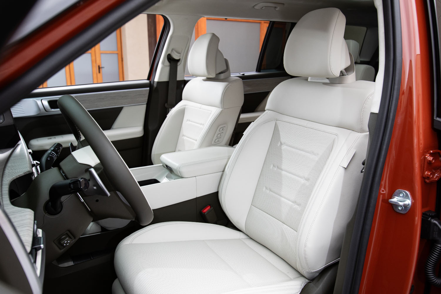 Front seats in an orange 2024 Hyundai Santa Fe