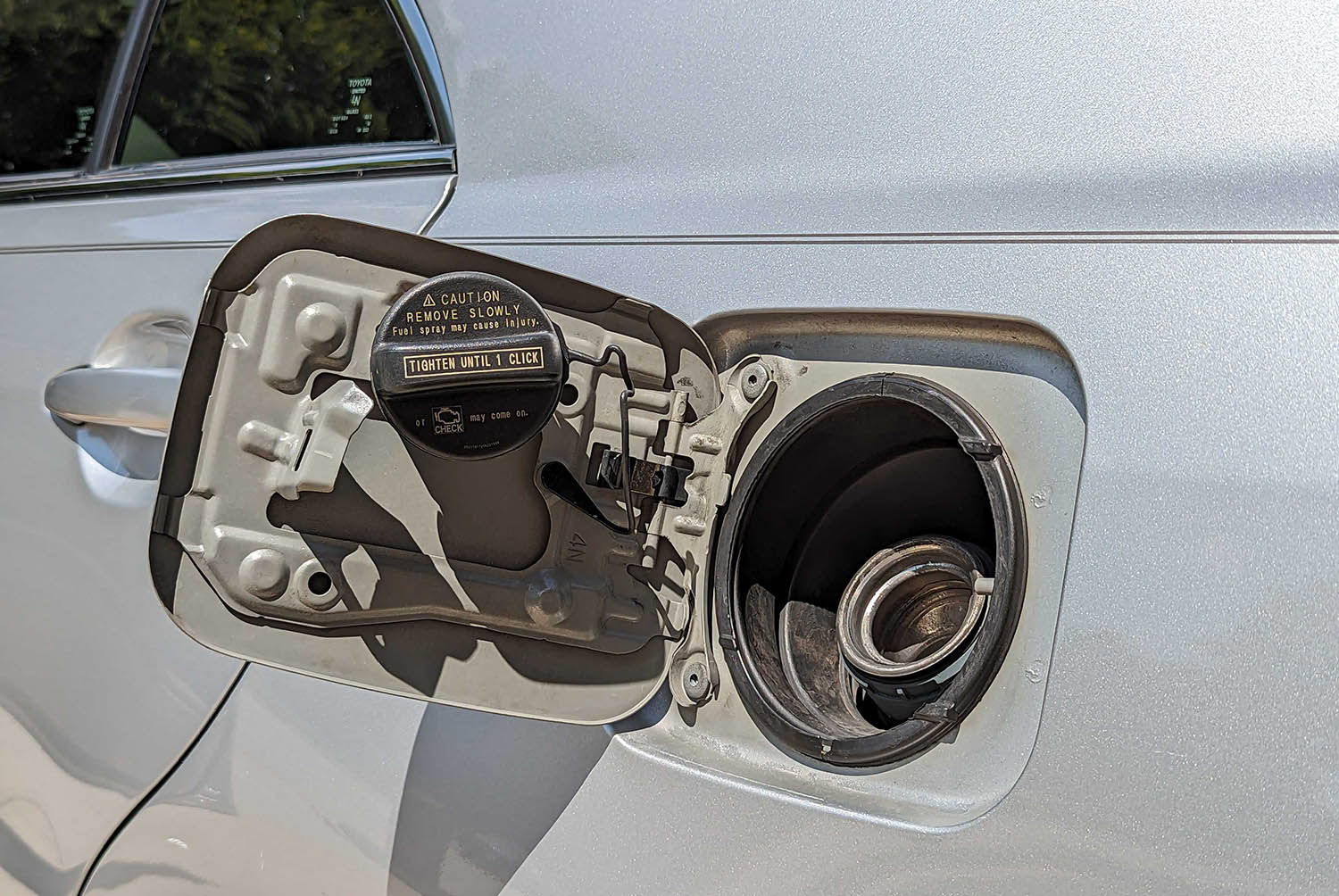 View of gas-cap holder on fuel door.