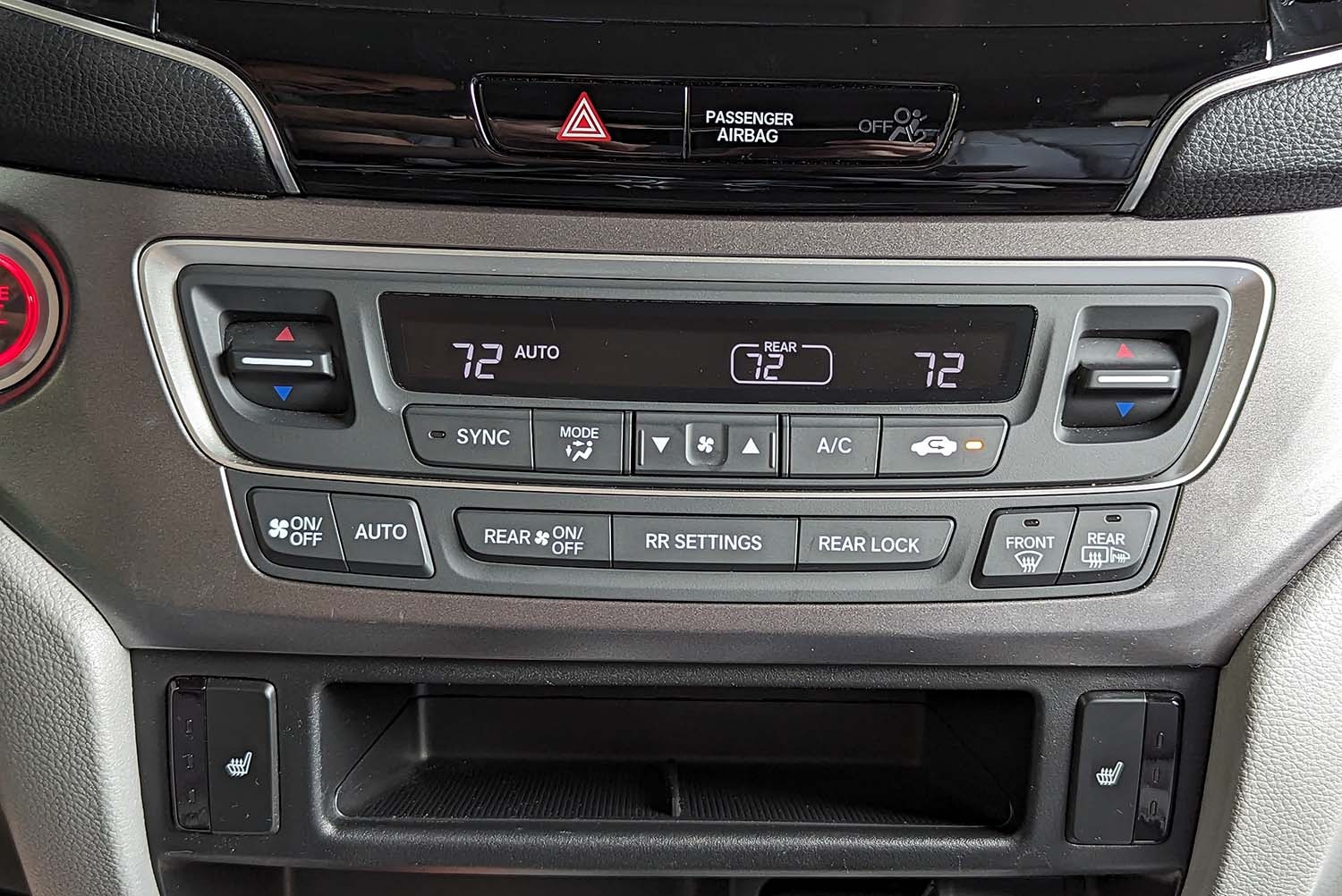 View of vehicle interior with automatic climate control enabled.