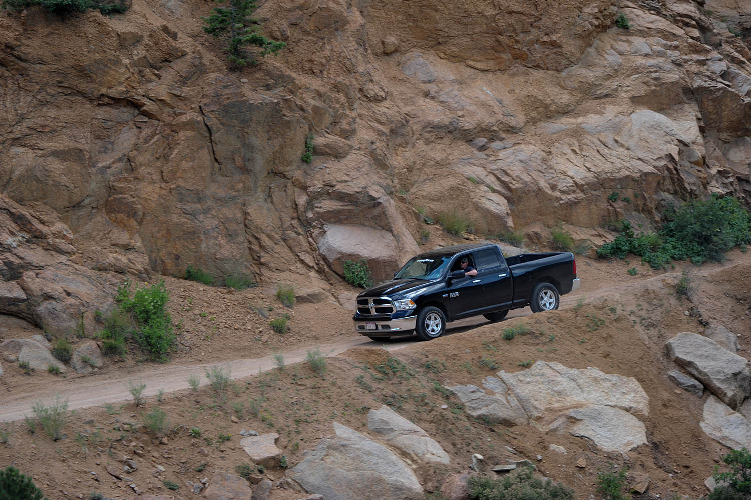 Ram pickup truck with Goodyear all-terrain tires on mountain road