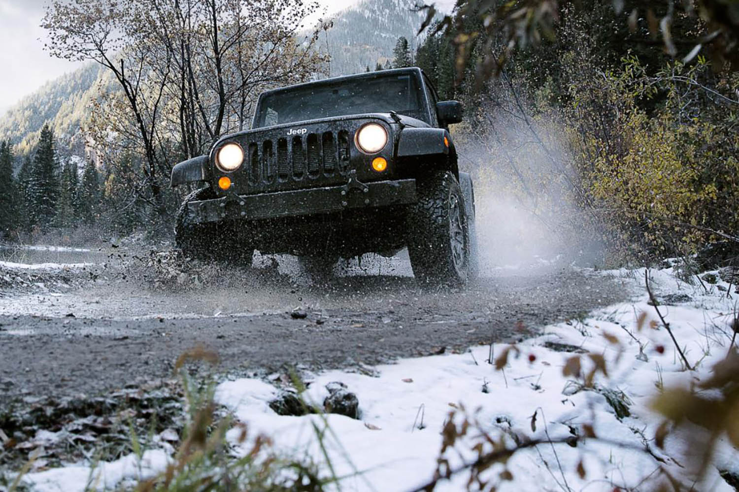 Jeep Wrangler with BFGoodrich all-terrain tires on a snowy road