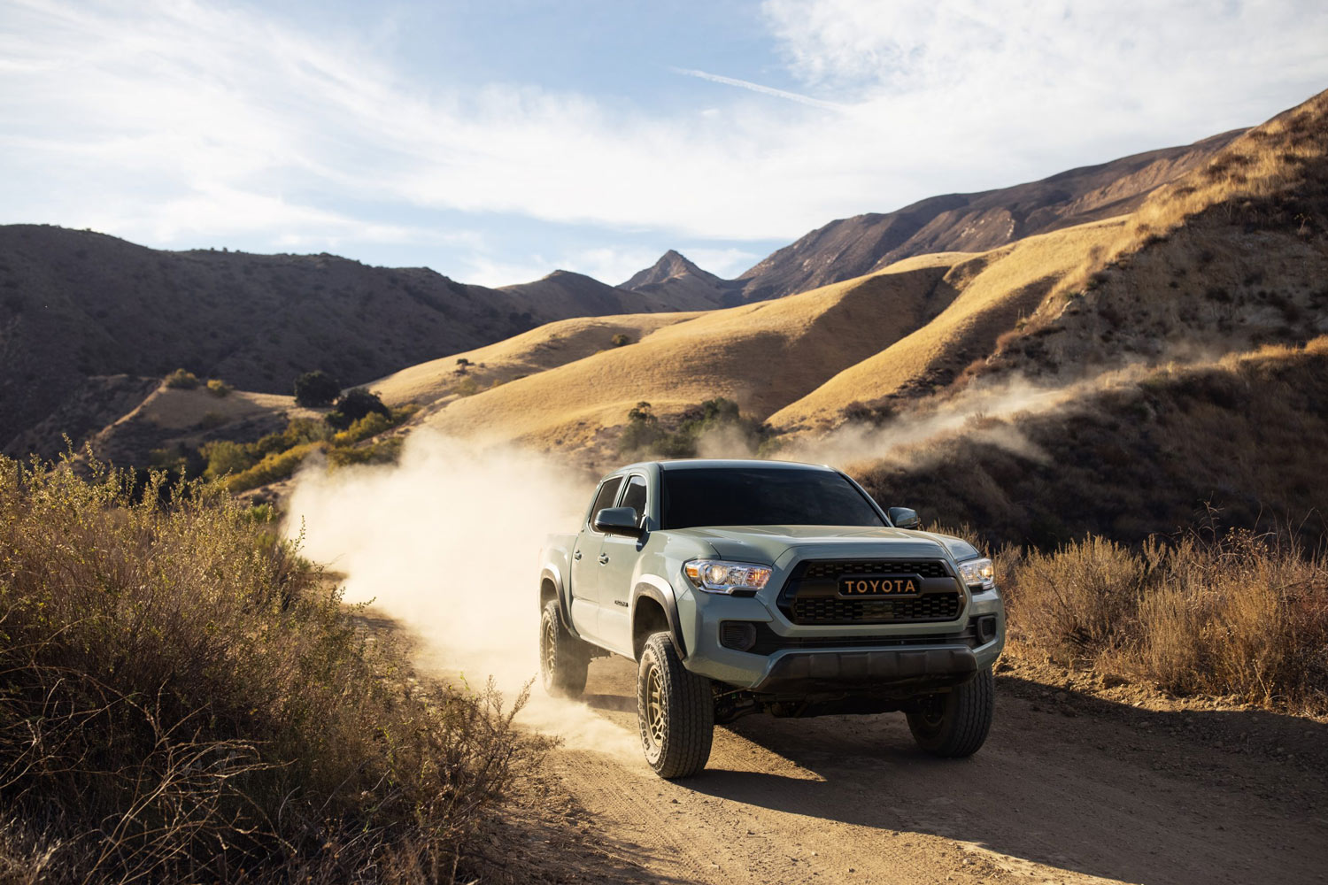 2023 Toyota Tacoma driving down a dirt trail