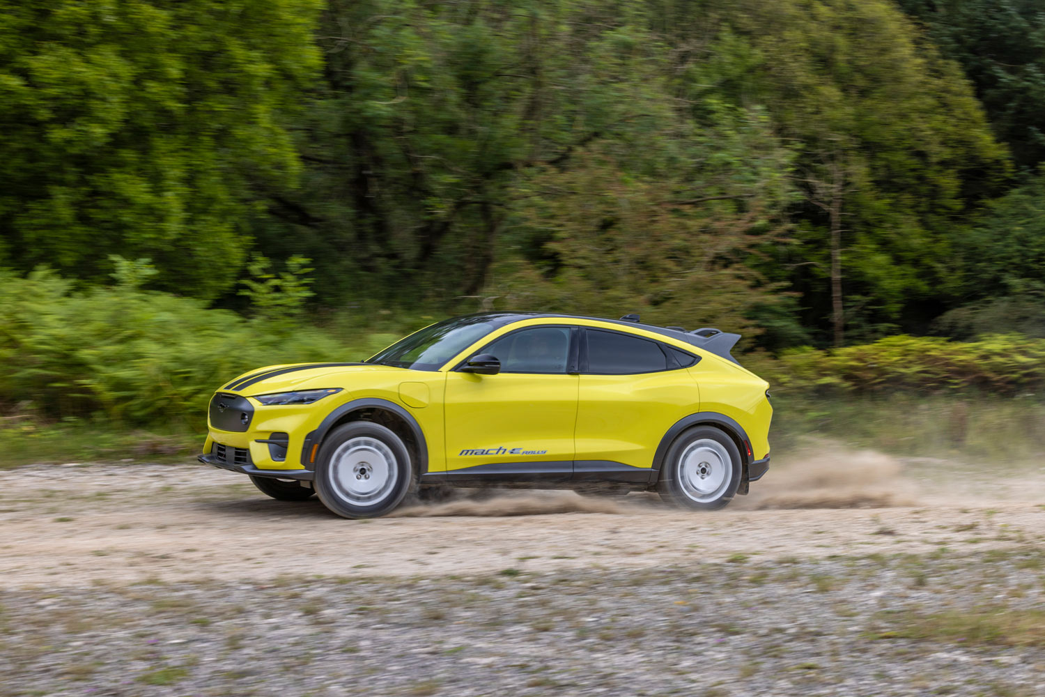 2024 Ford Mustang Mach-E Rally driving on dirt road
