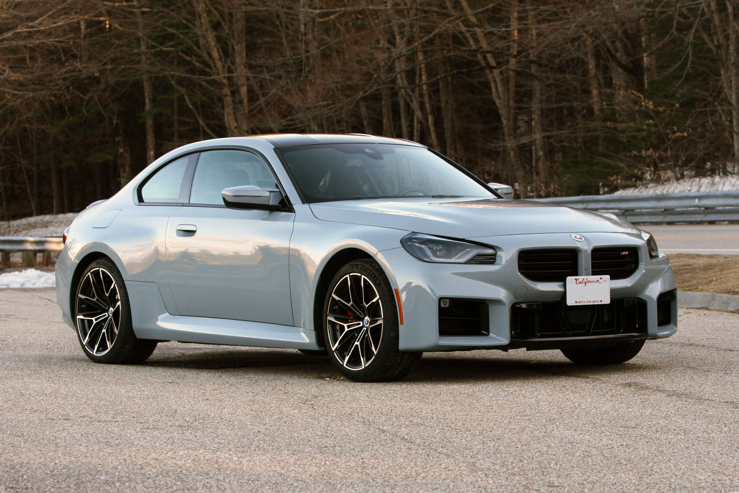 2023 BMW M2 in Brooklyn Grey Metallic parked in the New England countryside