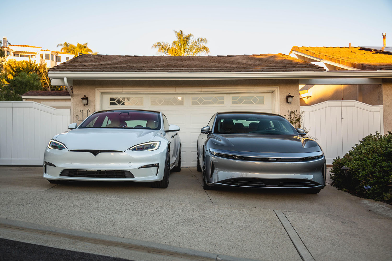 Two electric vehicles parked in a driveway in Southern California