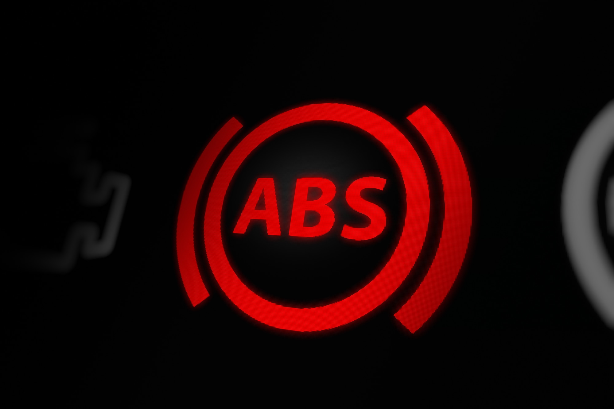 Anti-Lock Braking System (ABS) warning light on car dashboard
