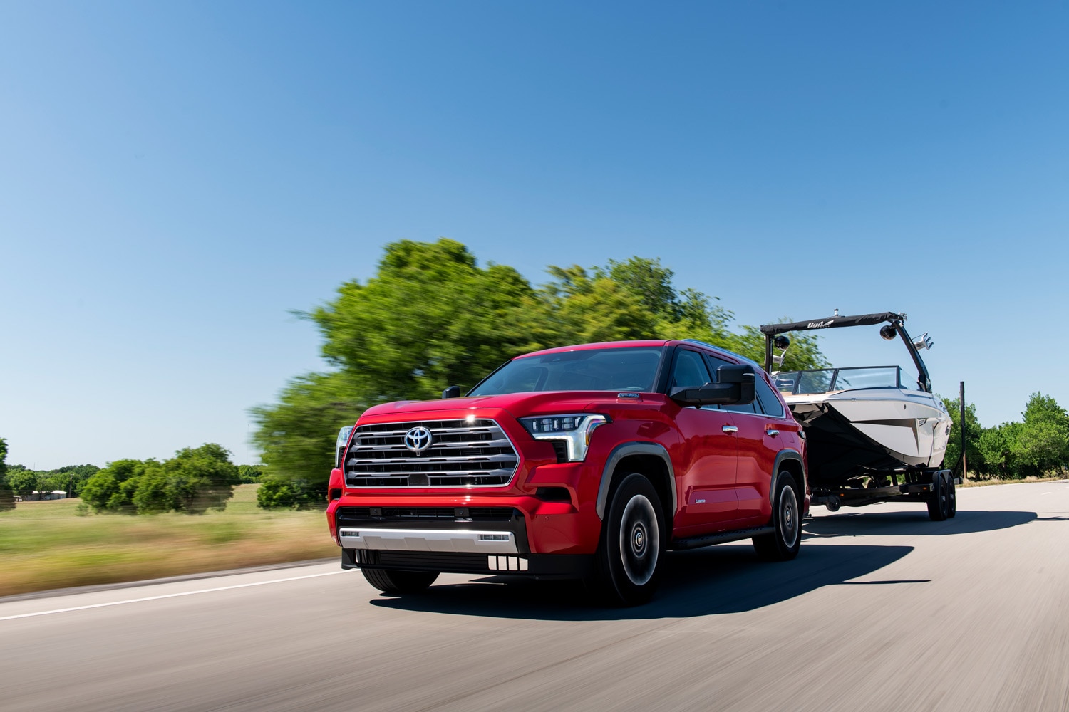 2023 Toyota Sequoia Capstone in Supersonic red towing ski boat