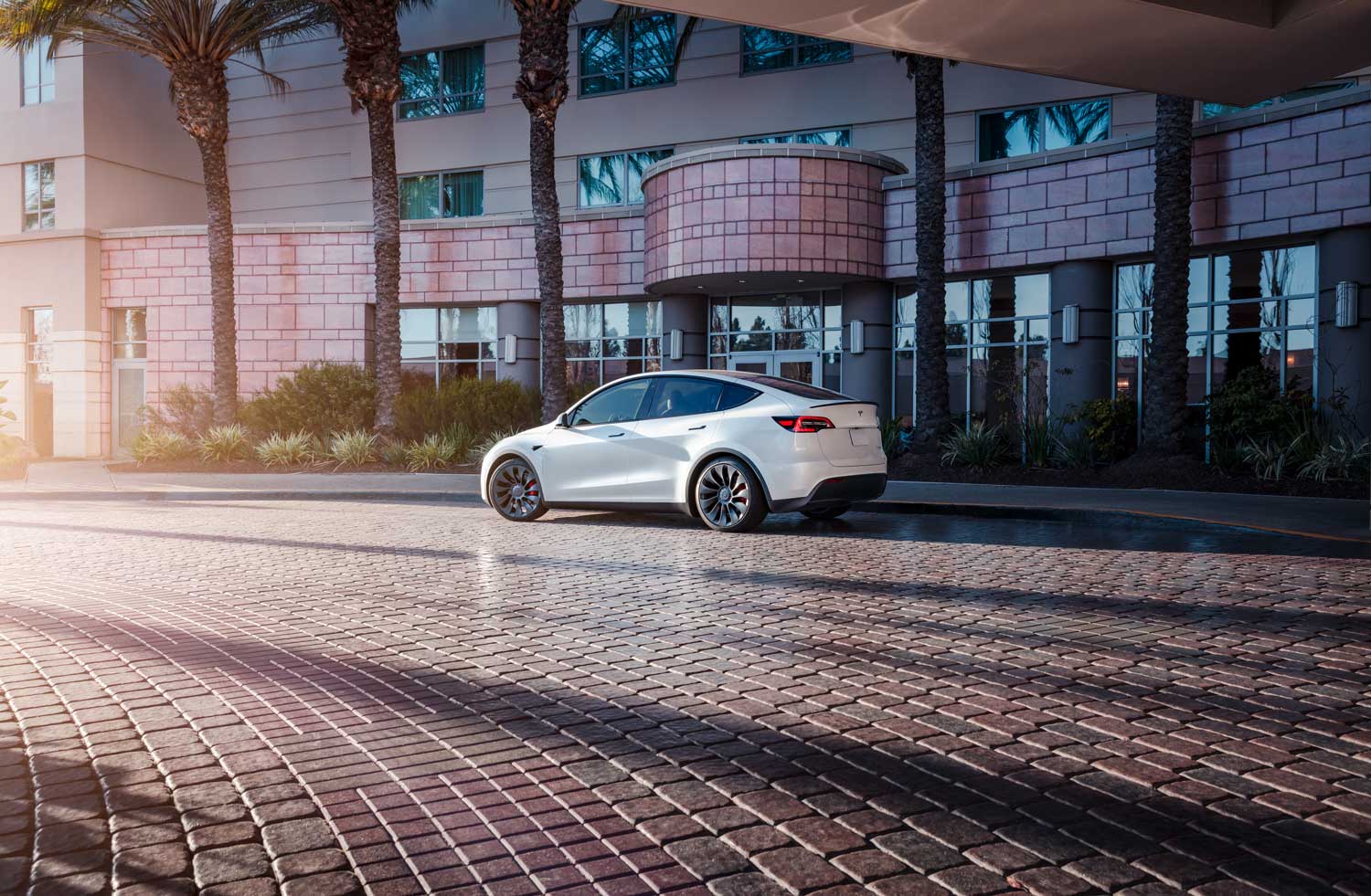 2022 Tesla Model Y in white rear 3/4 view