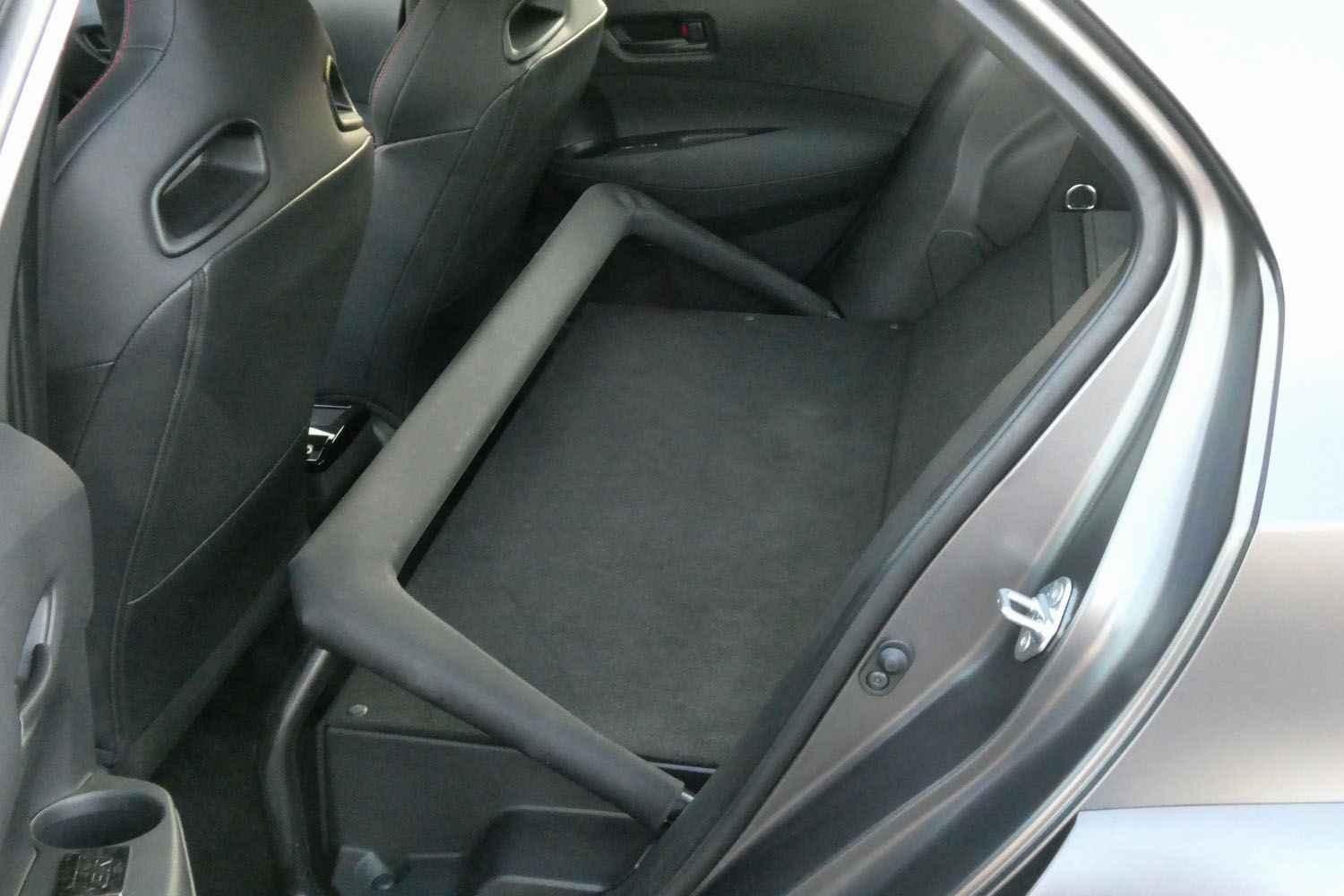 Interior of a 2023 Toyota GR Corolla Morizo Edition without a back seat.