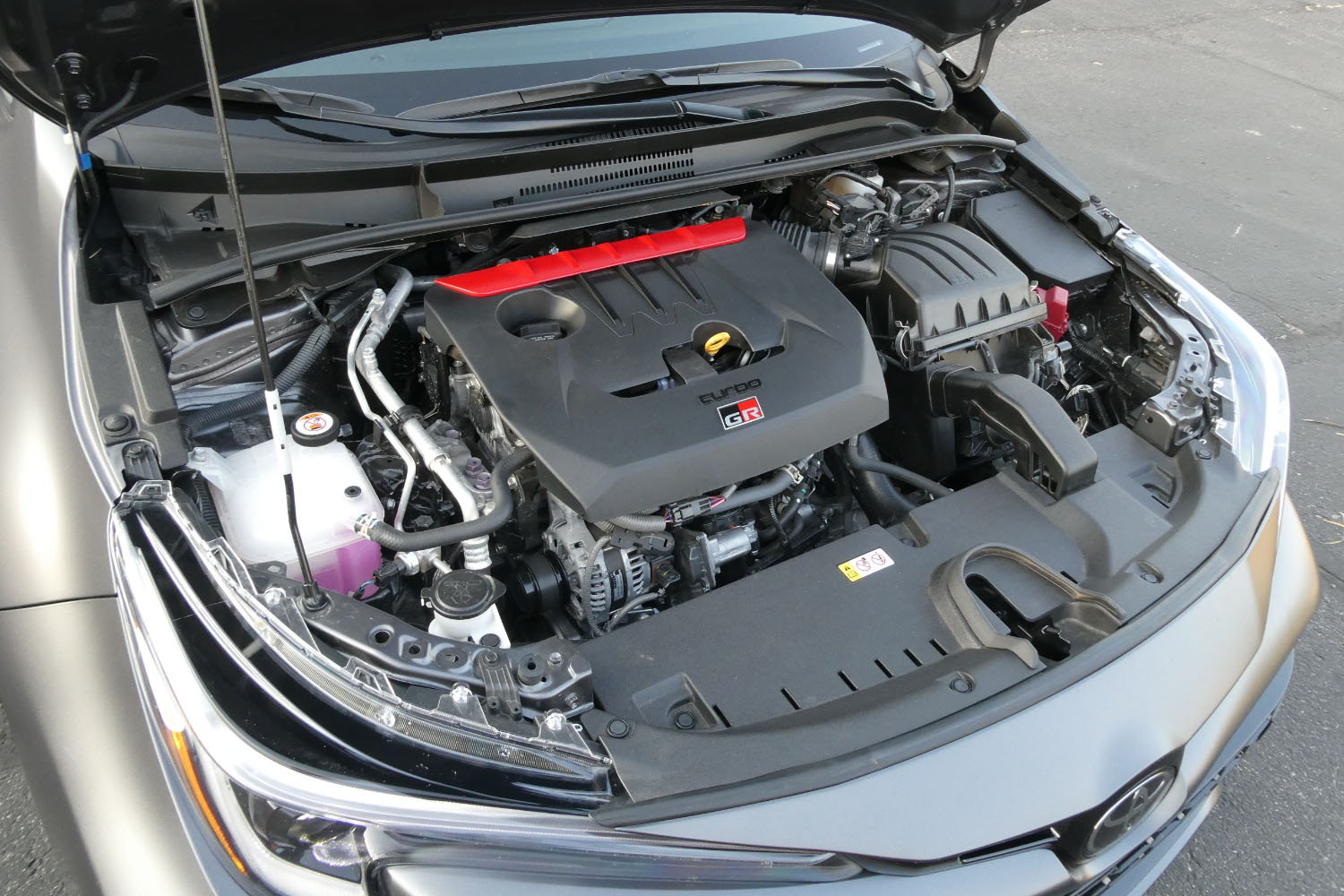 Under-the-hood engine view of a 2023 Toyota GR Corolla.