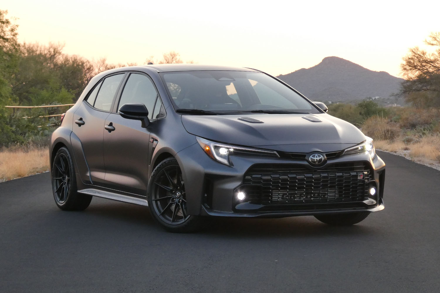 Front three-quarter view of a 2023 Toyota GR Corolla in Smoke gray.