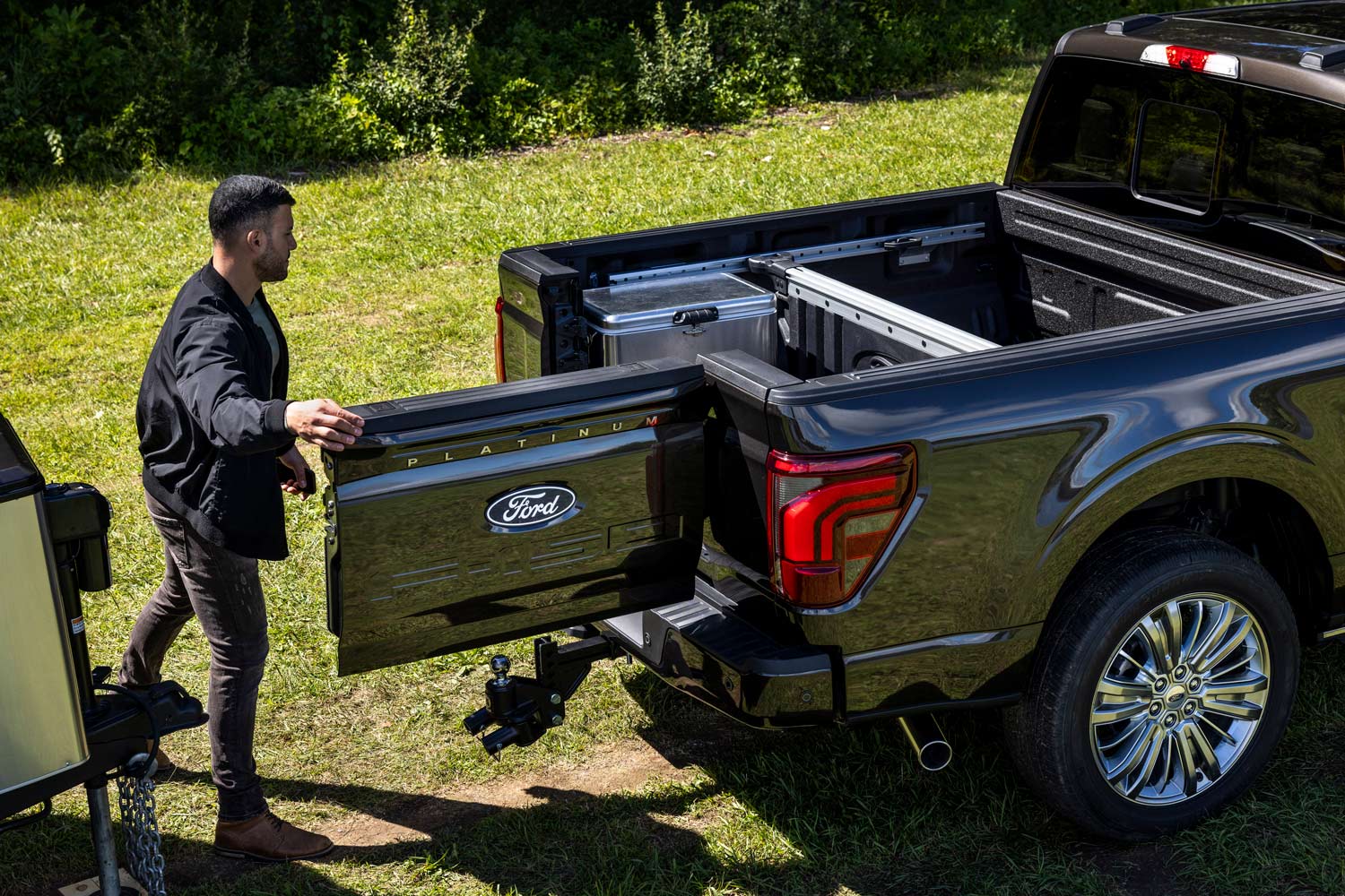 Swing-open tailgate on a black 2024 Ford F-150