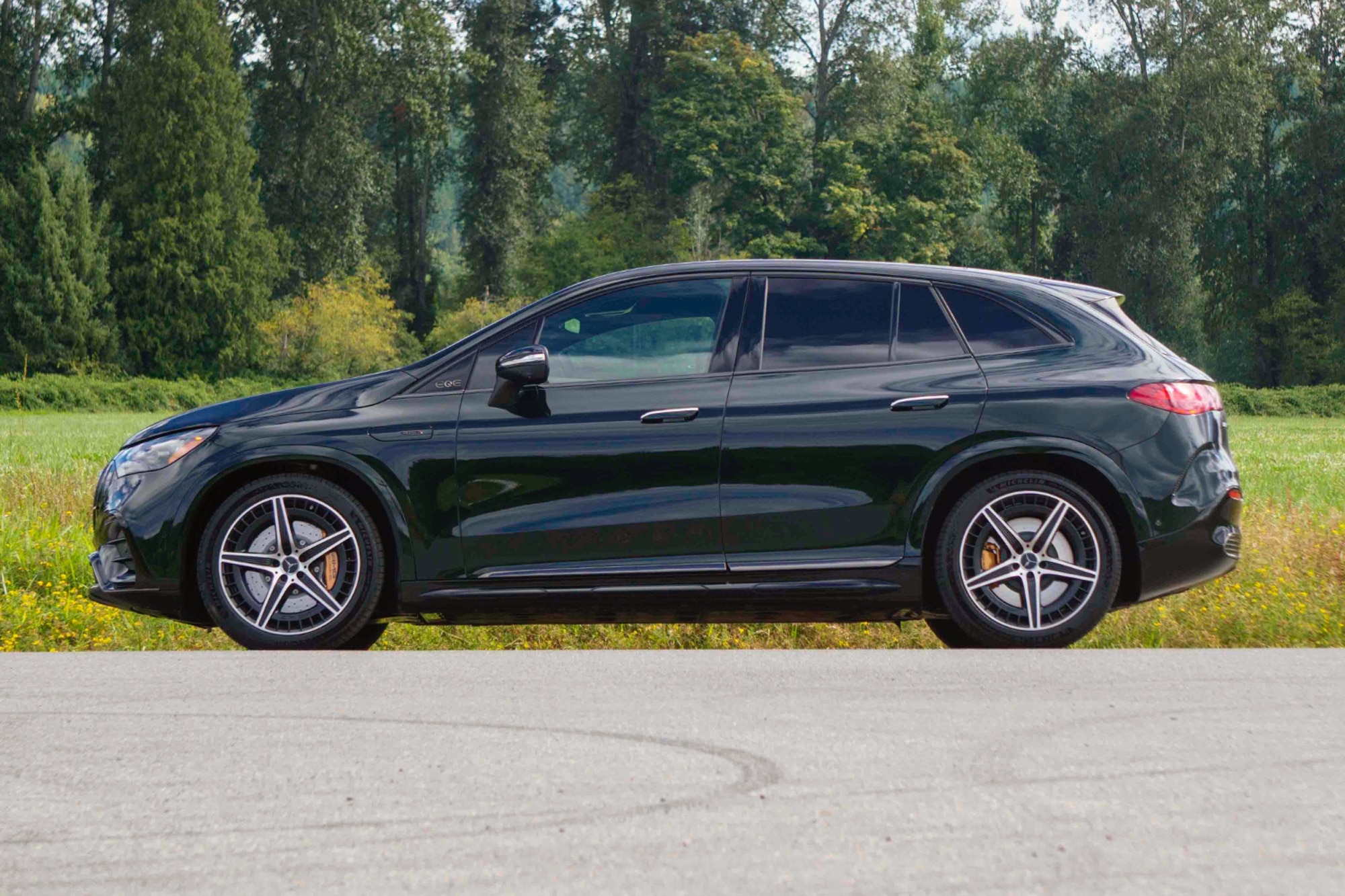 2024 Mercedes-AMG EQE SUV side view parked on the side of the road