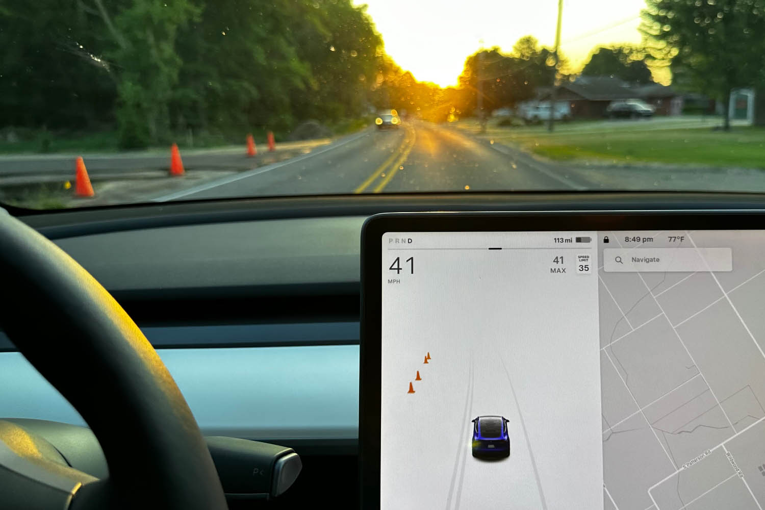  Infotainment screen in a 2023 Tesla Model Y with ADAS options displayed.