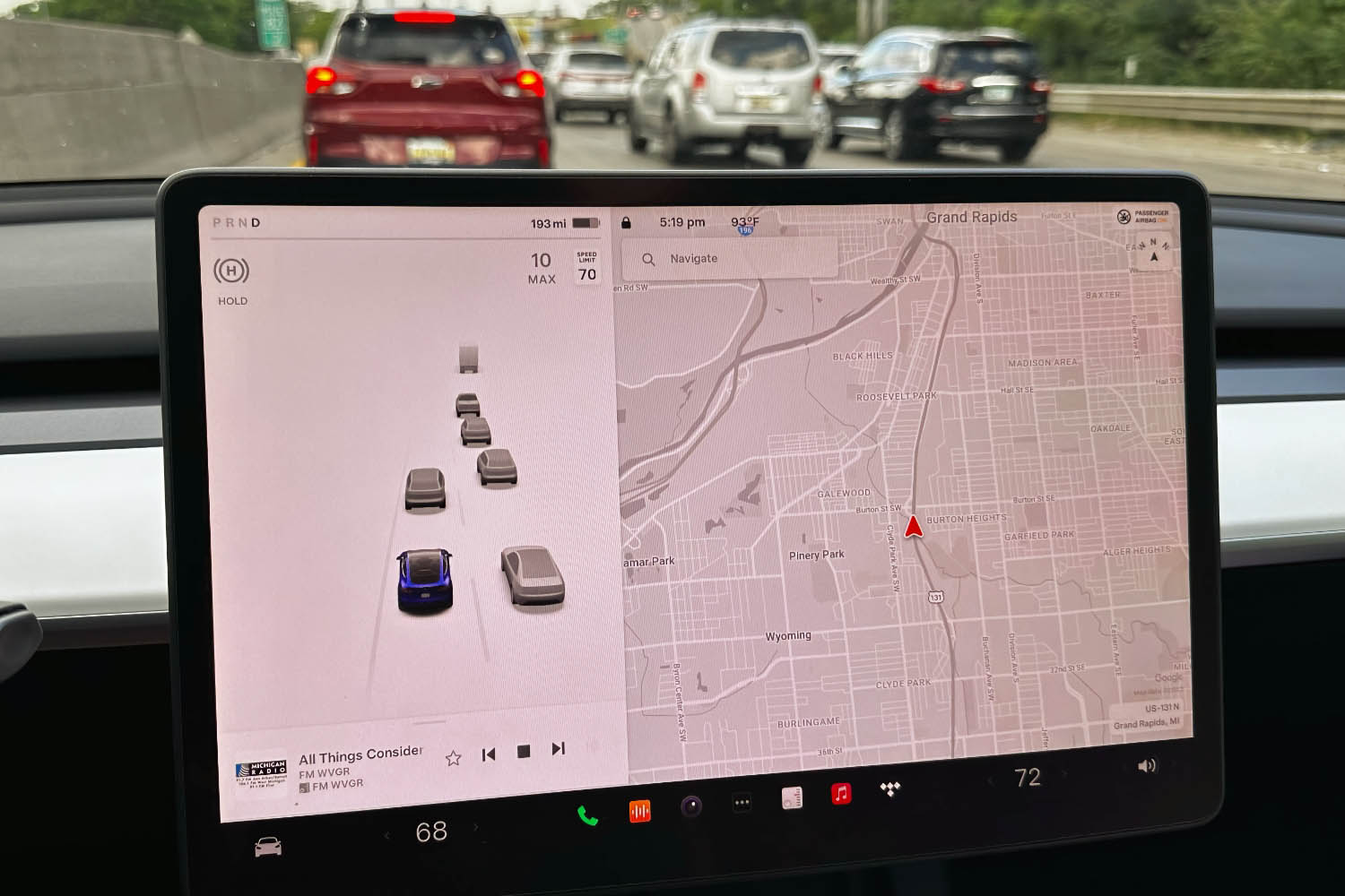  Infotainment screen in a 2023 Tesla Model Y displaying safety features.