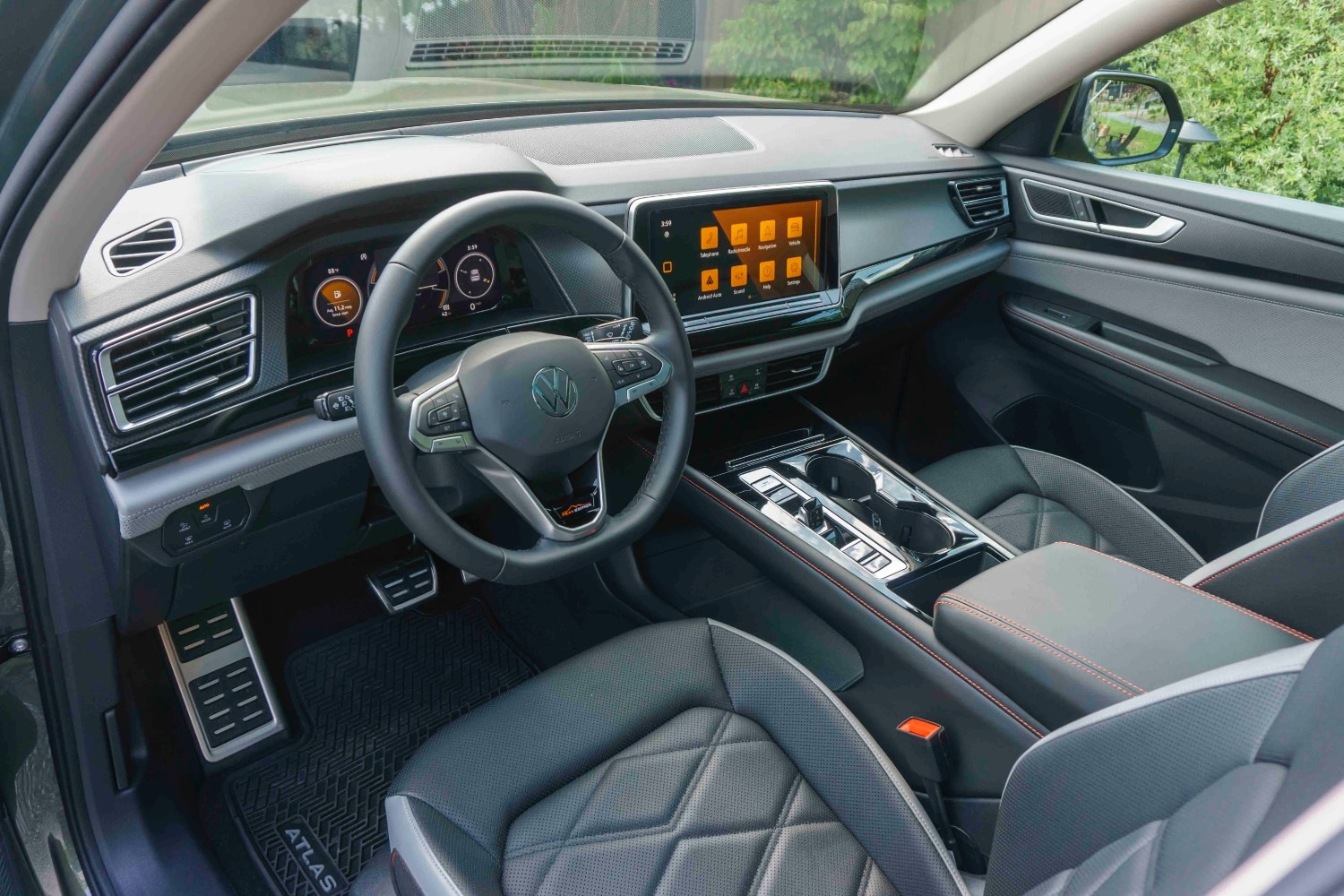  2024 Volkswagen Atlas Peak Edition Titan Black leather with Silver underlay front interior