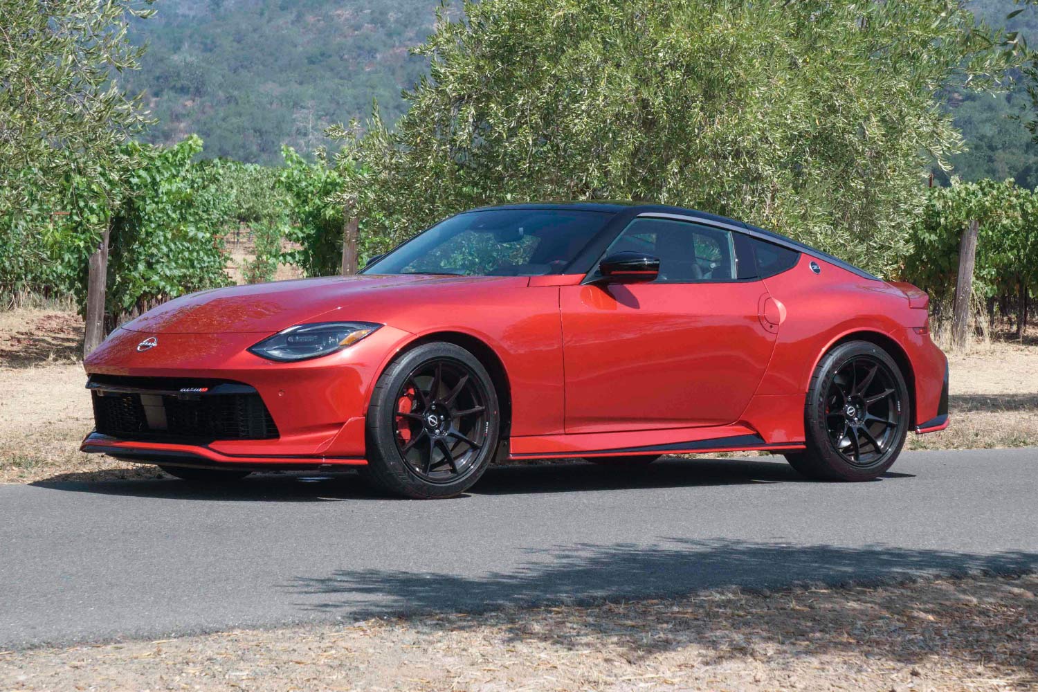 Red 2024 Nissan Z Nismo parked by vineyard