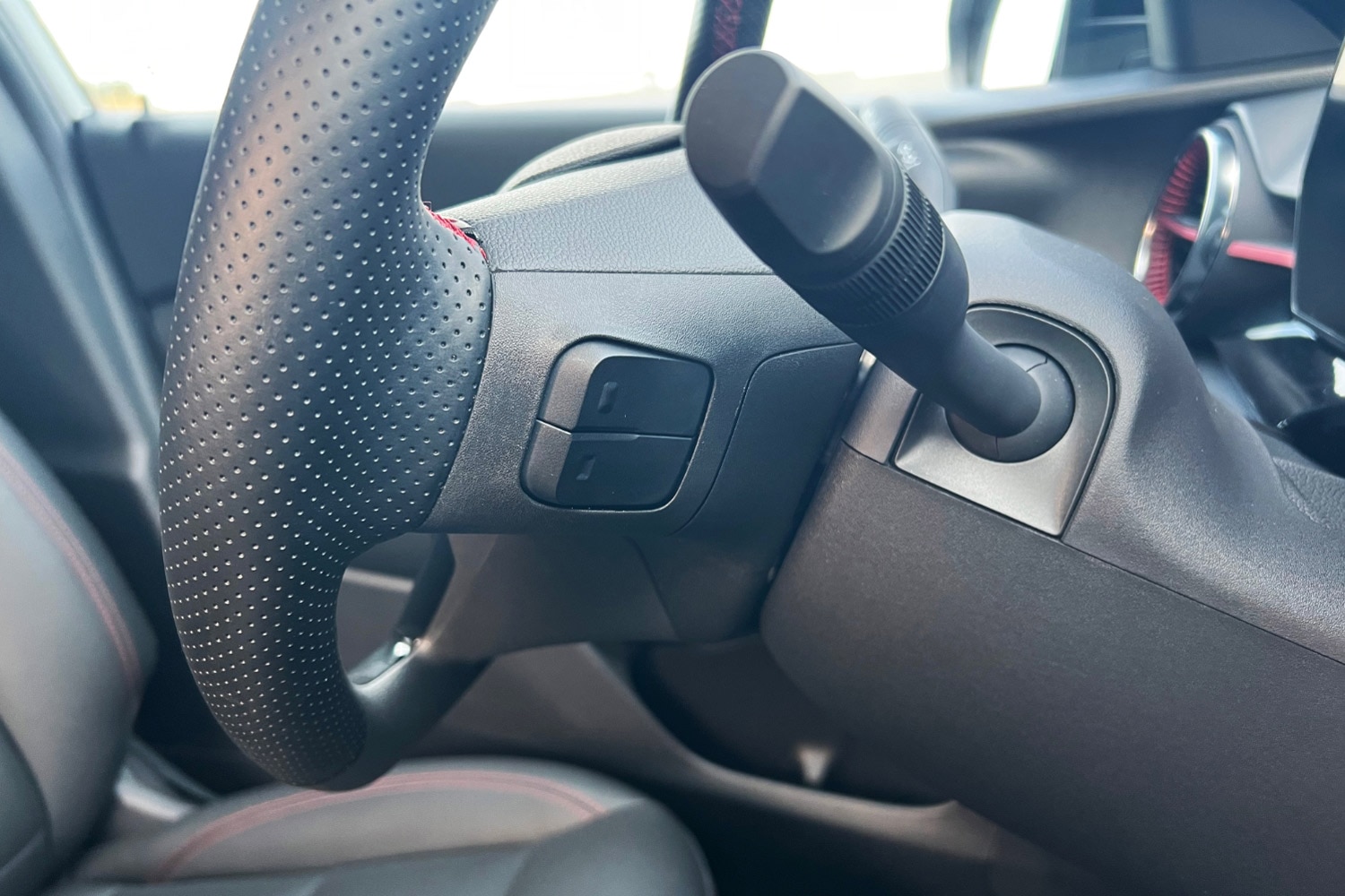Close-up of controls on the back of the steering wheel in a 2024 Chevrolet Trax
