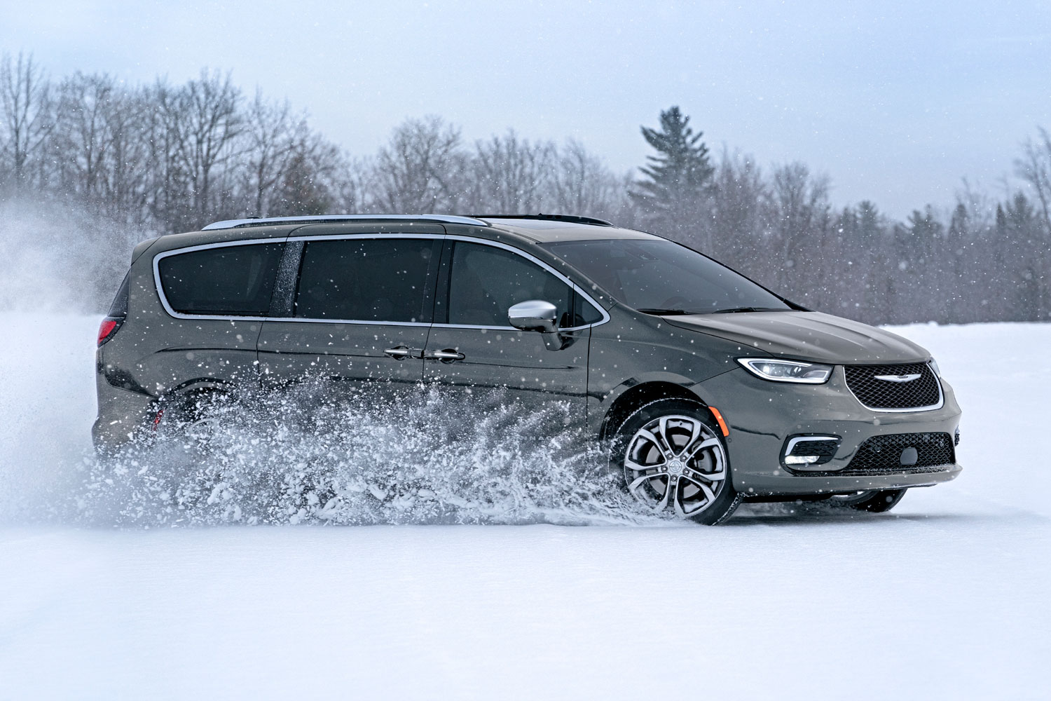 Side view of gray 2022 Chrysler Pacifica in snow