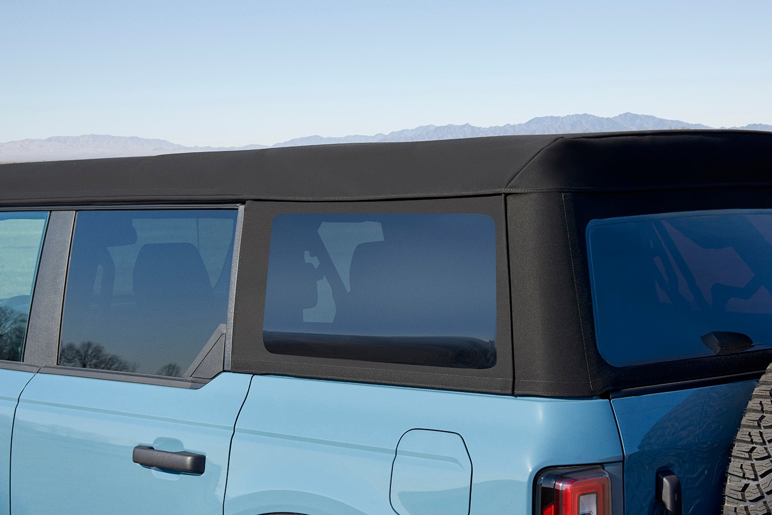 2021 Ford Bronco four-door Badlands in blue, convertible soft top close-up