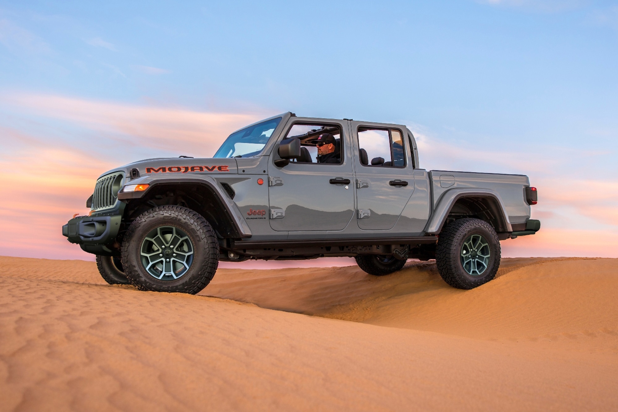 2024 Jeep Gladiator Mojave in gray driving over desert sand
