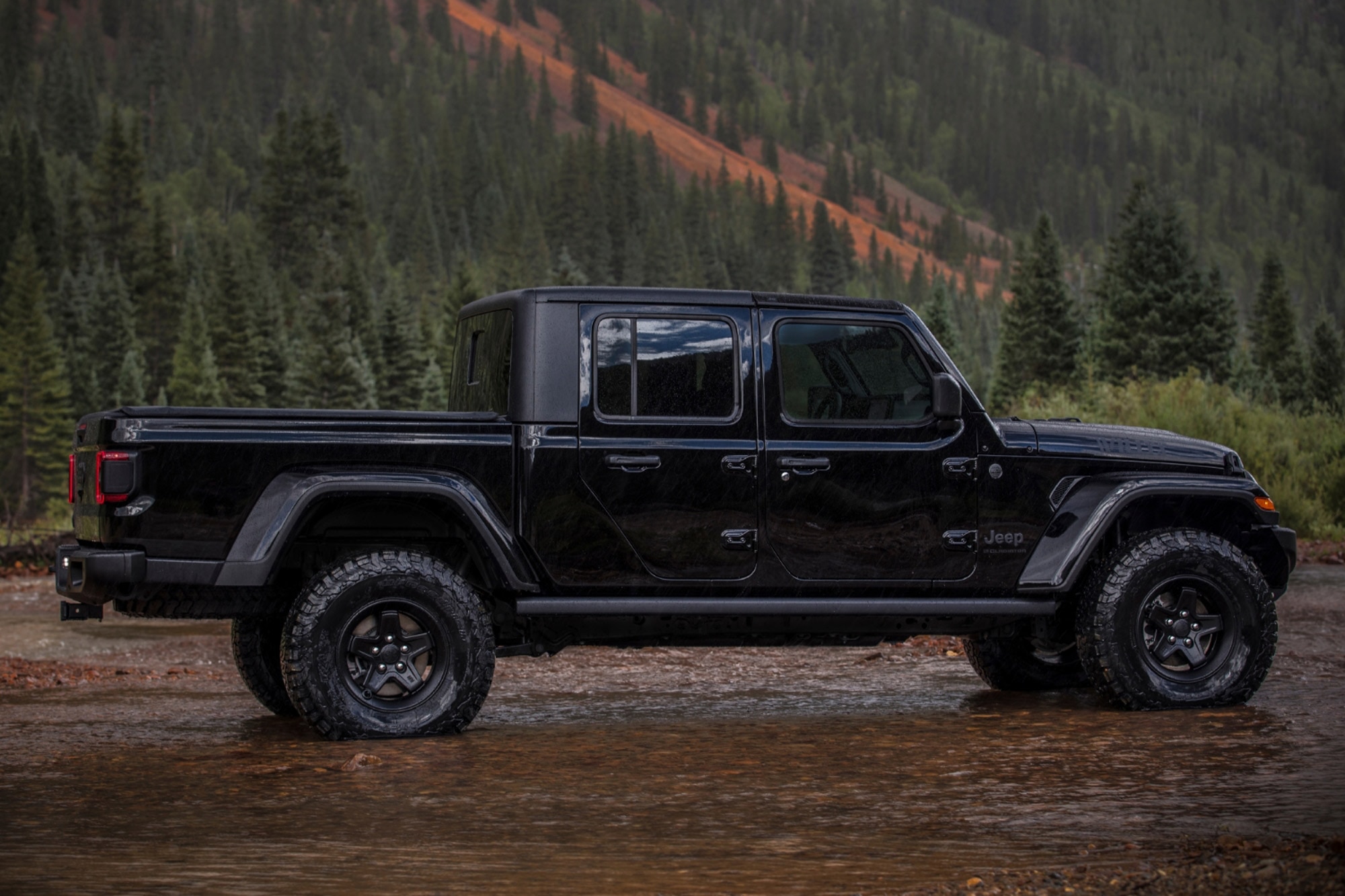 2024 Jeep Gladiator Willys in black parked on the lake