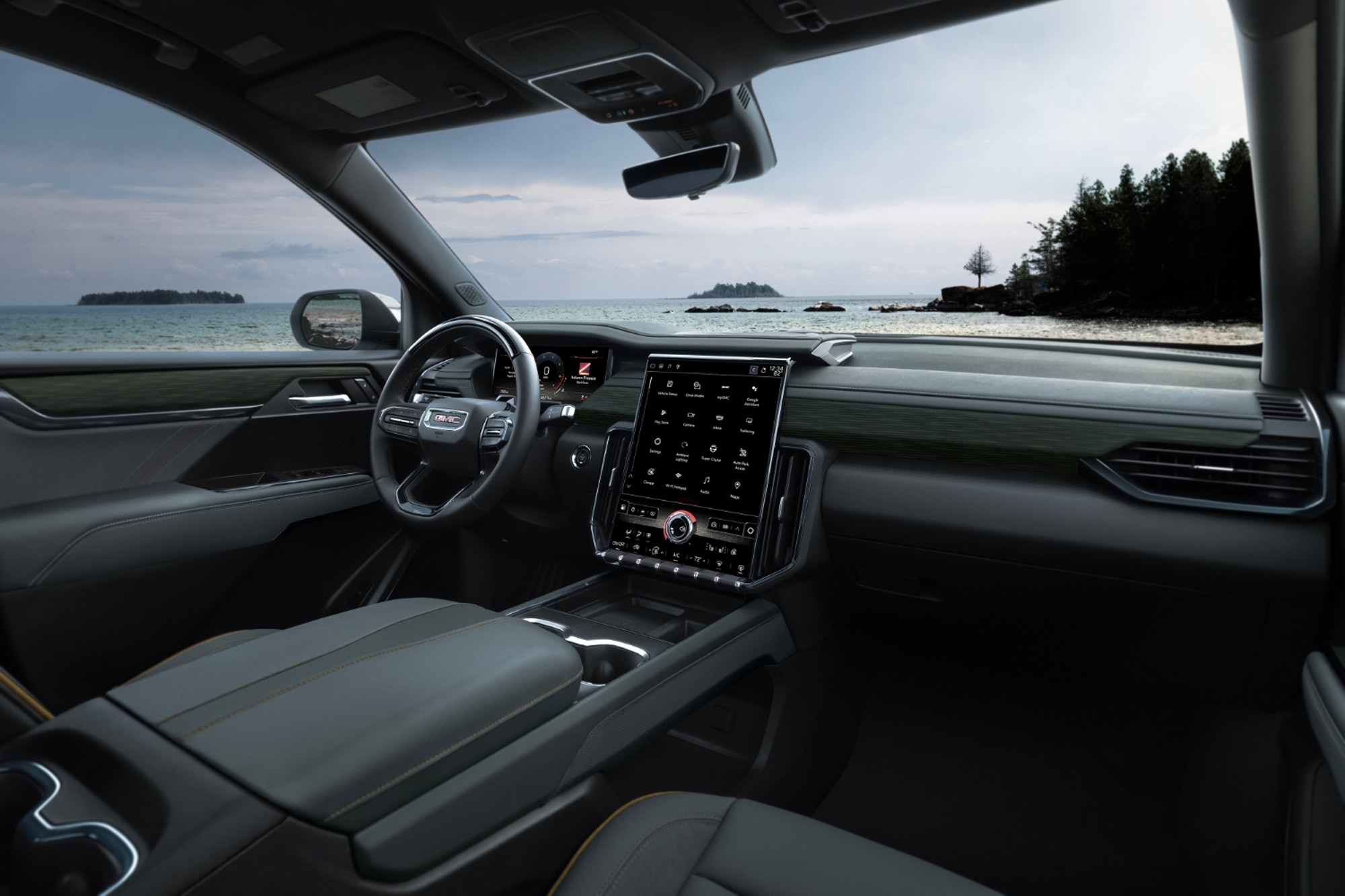 2024 GMC Acadia AT4 dashboard with view of the ocean and forest