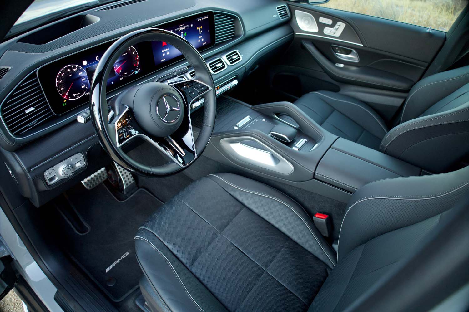 Dashboard and driver's seat inside 2024 Mercedes-Benz GLS-Class in Alpine Grey