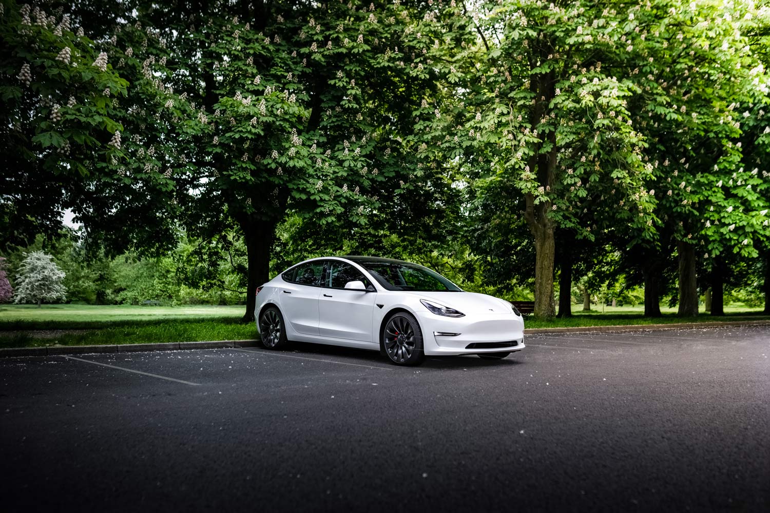 Front three-quarter view of a white 2023 Tesla Model 3