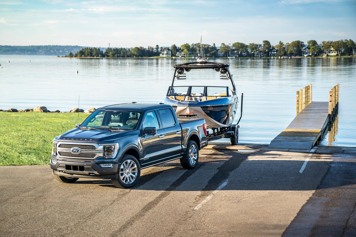 2023 Ford F-150 parked at boat launch ramp with trailer and boat hitched.