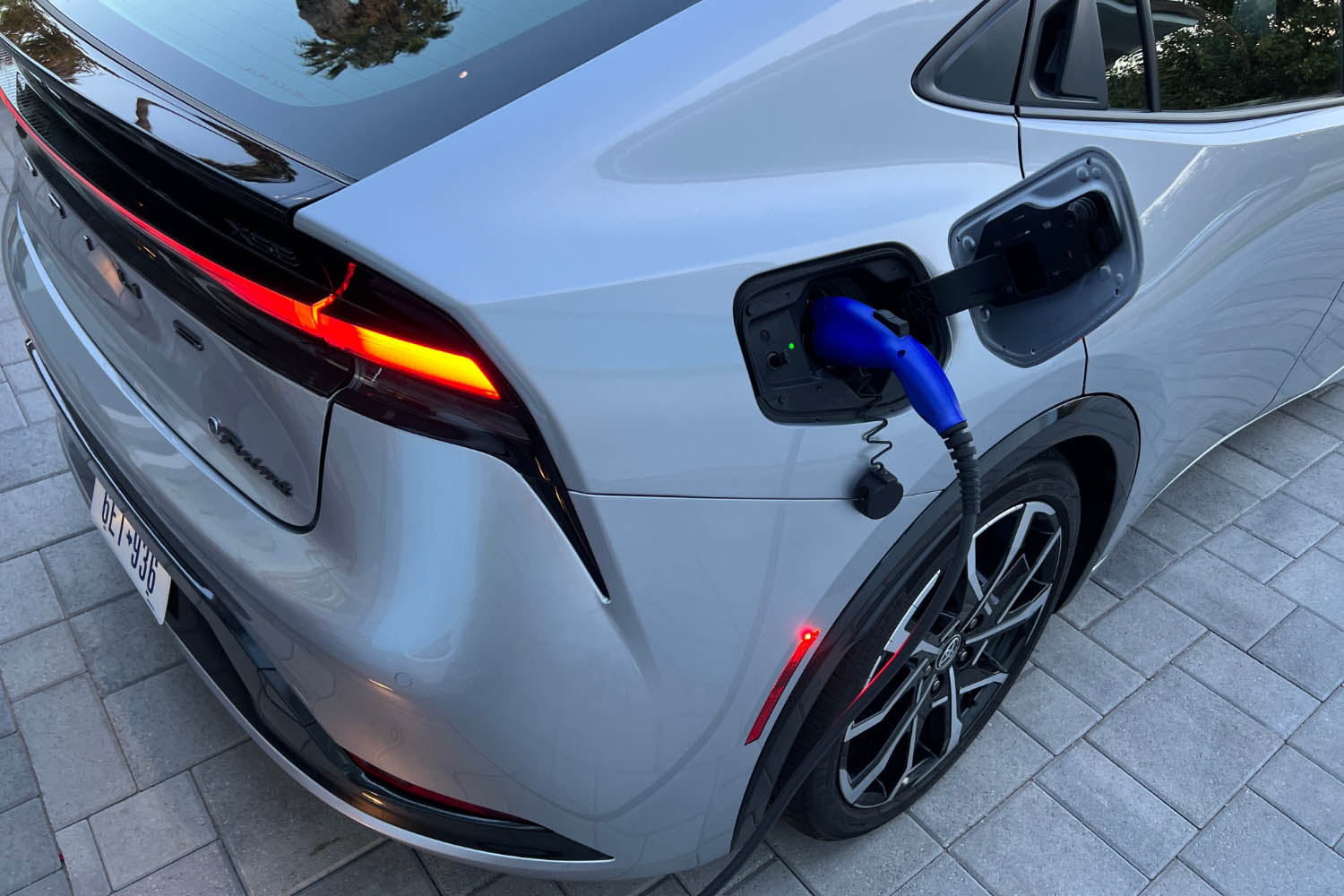 Charging port of the 2023 Toyota Prius Prime with charger attached