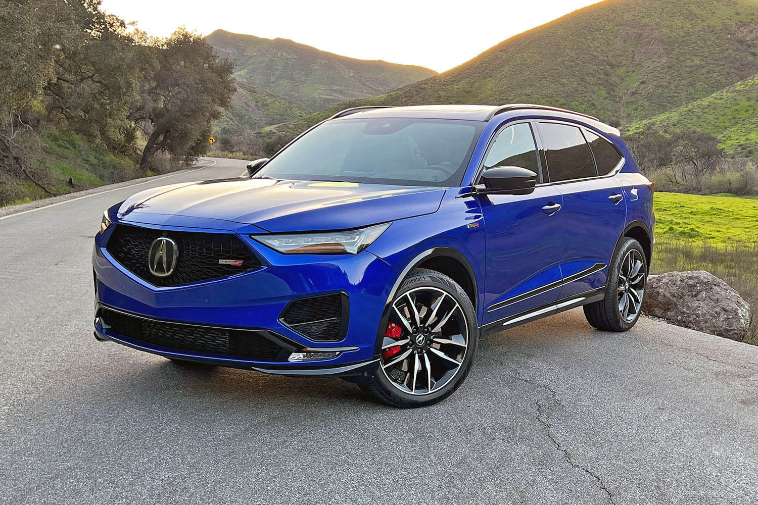 2023 Acura MDX Type S in Apex Blue Pearl, front three-quarter view.